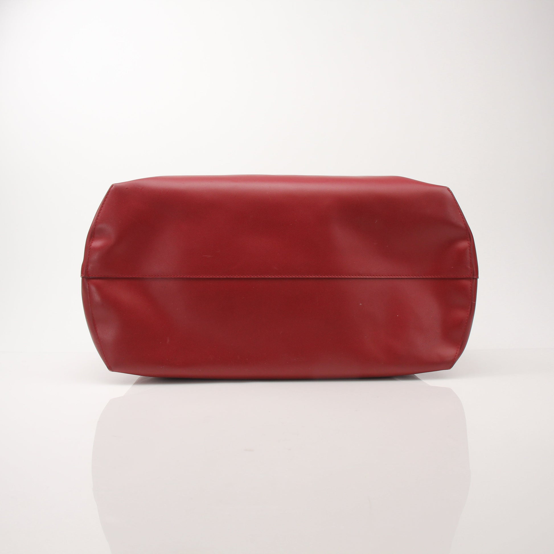 Fendi red monster-themed roll tote bag by Gold & Beyond, featuring a playful monster design on a stylish handbag.