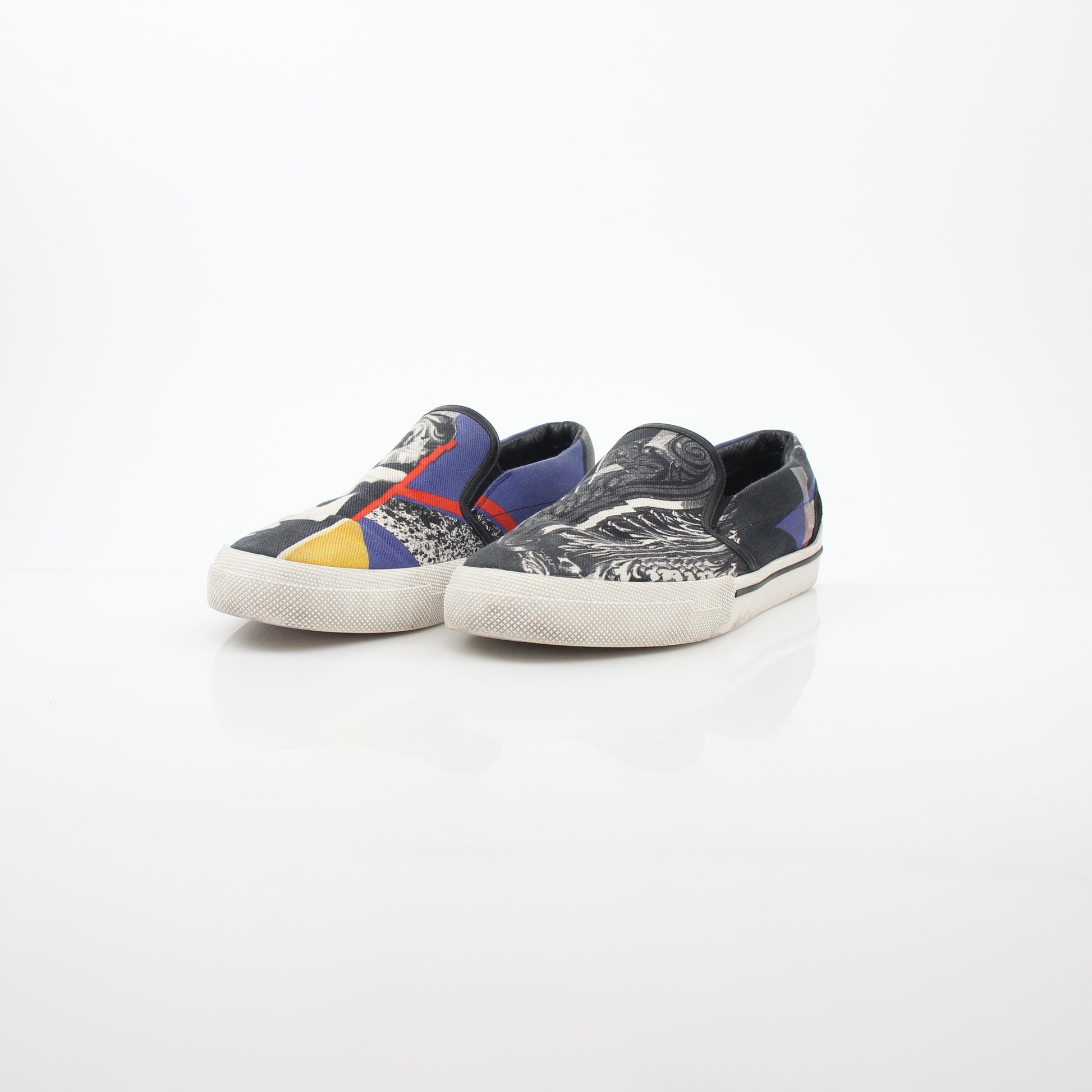 Versace men's graphic print canvas slip-on sneakers with bold design and comfortable fit, by Gold & Beyond.