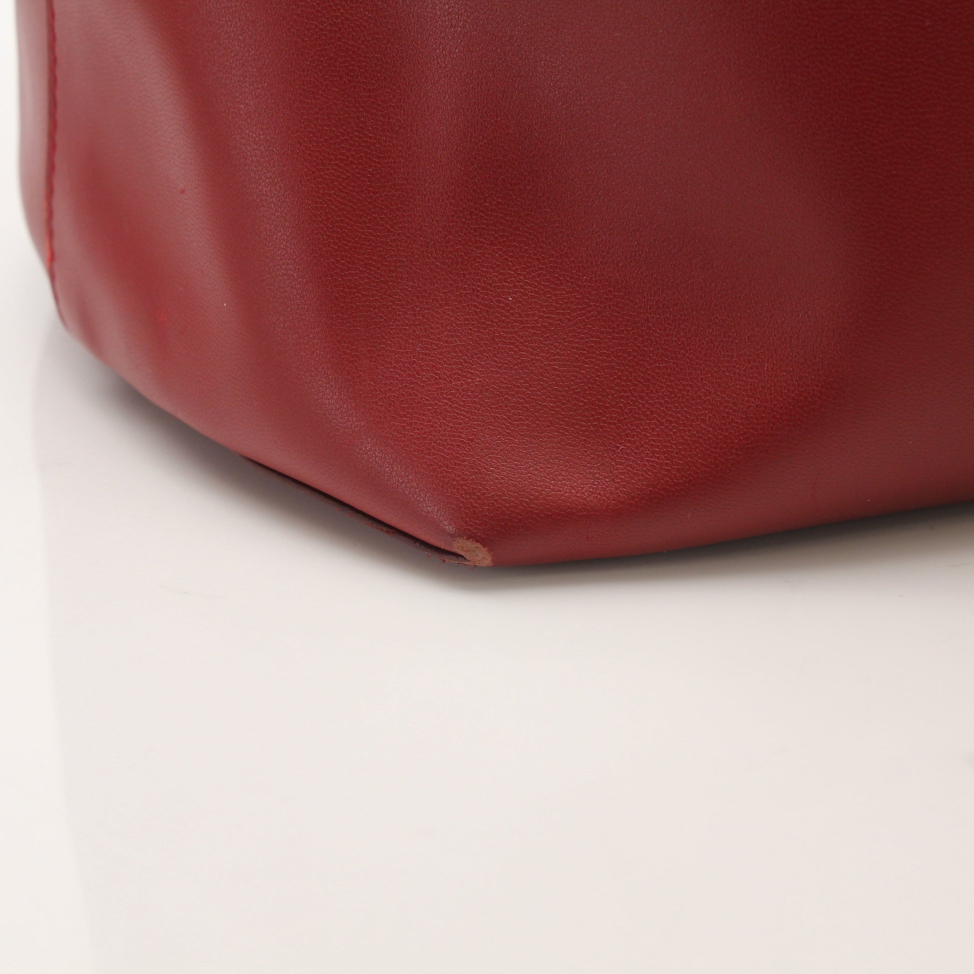 Red Fendi Monster Roll Tote Handbag with gold accents and bold design, featuring the signature monster motif.