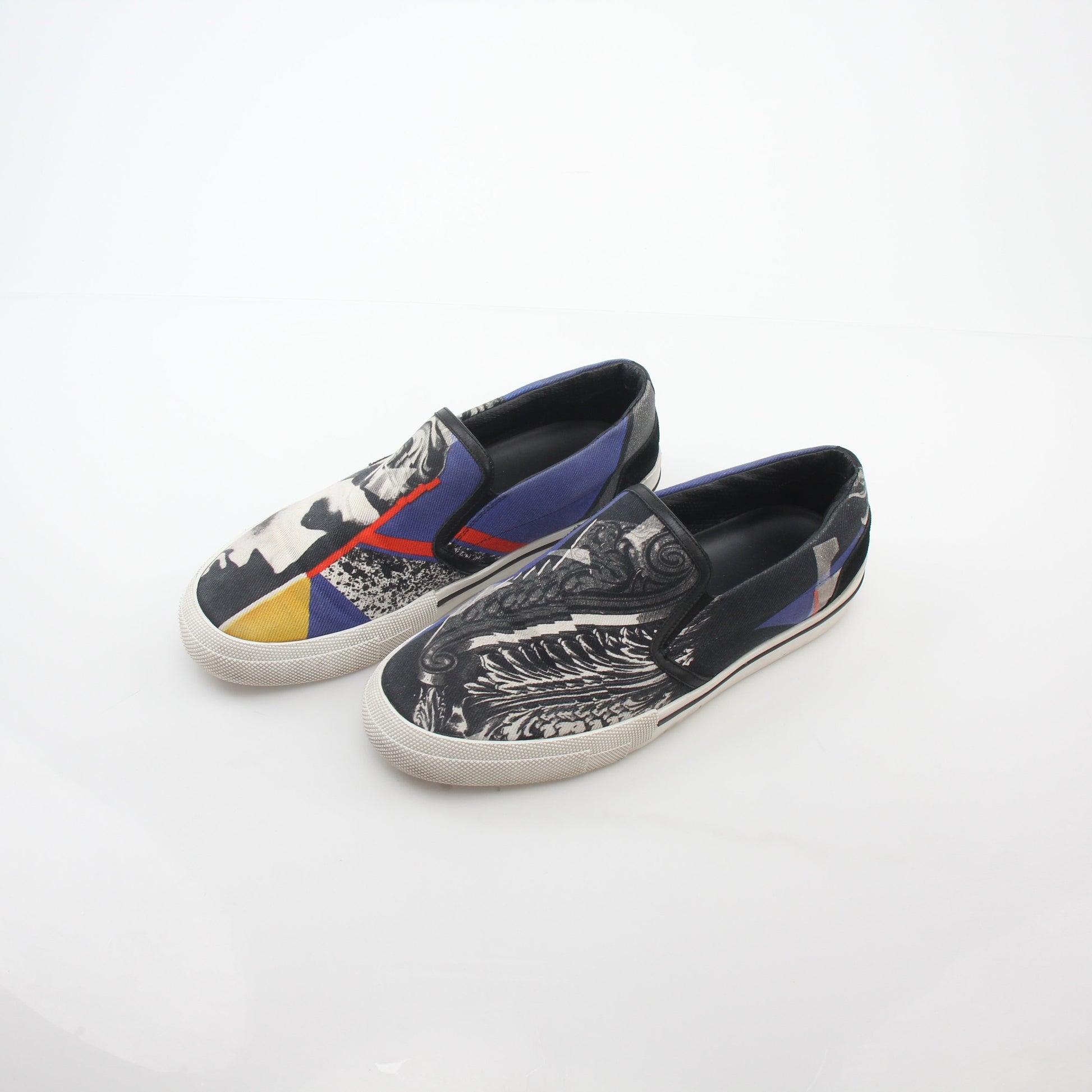 Versace men's graphic print canvas slip-on sneakers with bold design, featuring comfortable slip-on style and stylish branding.