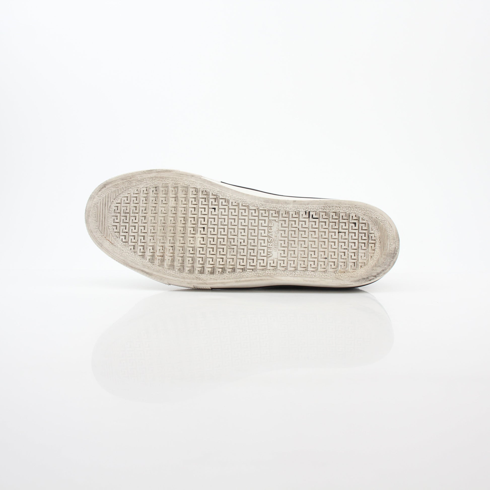 Versace men's graphic print canvas slip-on sneakers with bold design and comfortable fit, by Gold & Beyond.