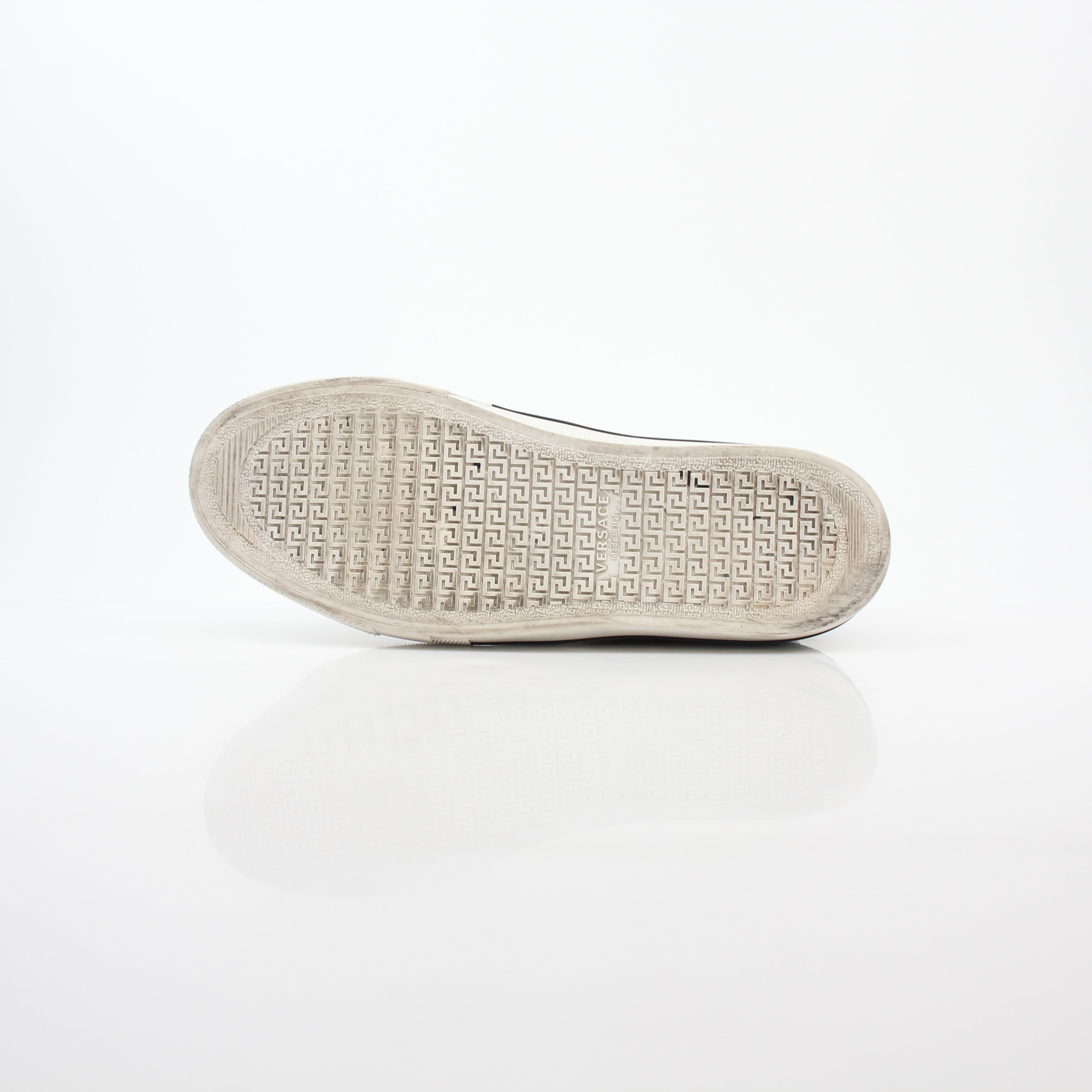 Versace men's graphic print canvas slip-on sneakers with bold design and comfortable fit, by Gold & Beyond.
