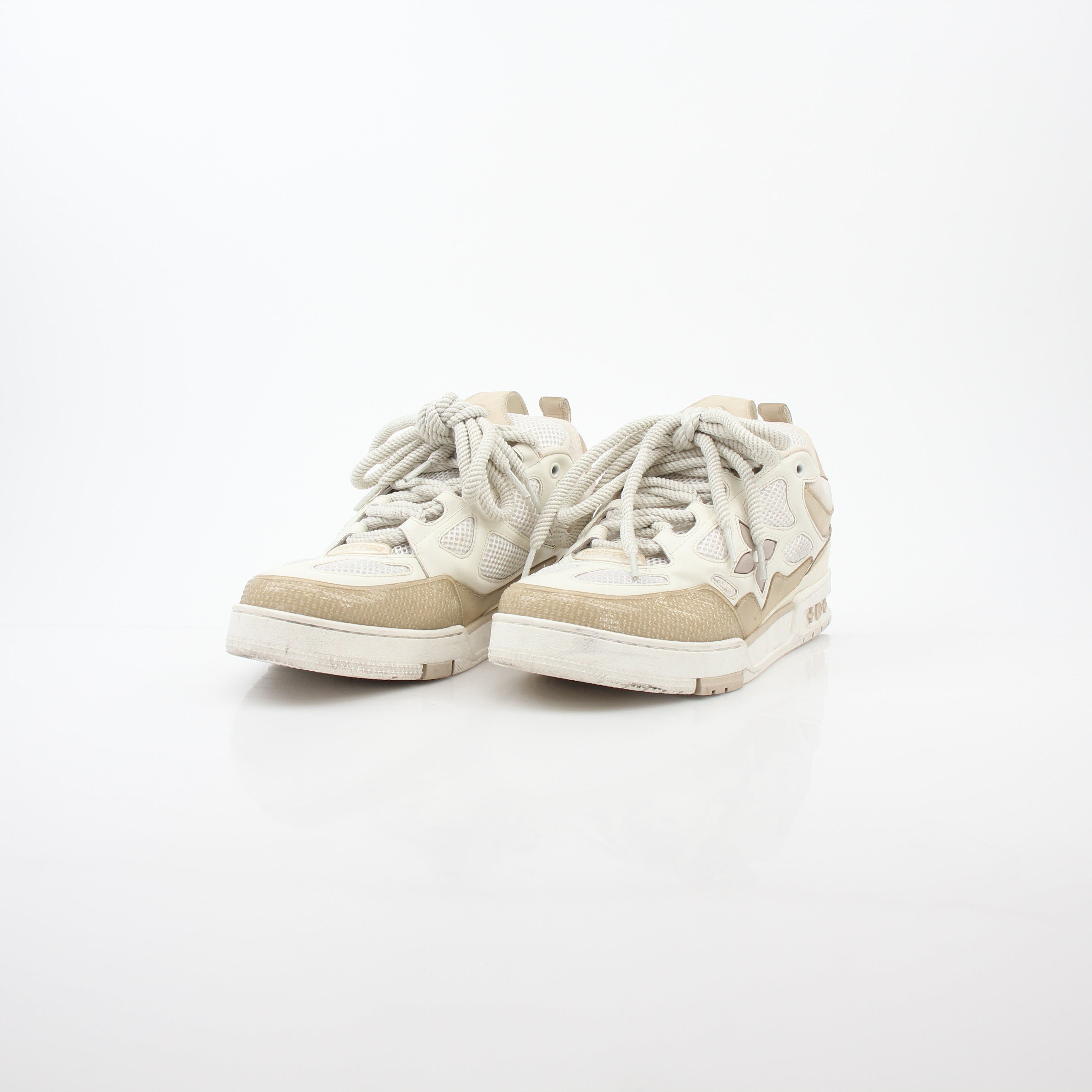 Louis Vuitton men's LV Skate sneaker in beige, stylish casual shoes from Gold & Beyond, with leather detailing and iconic branding.
