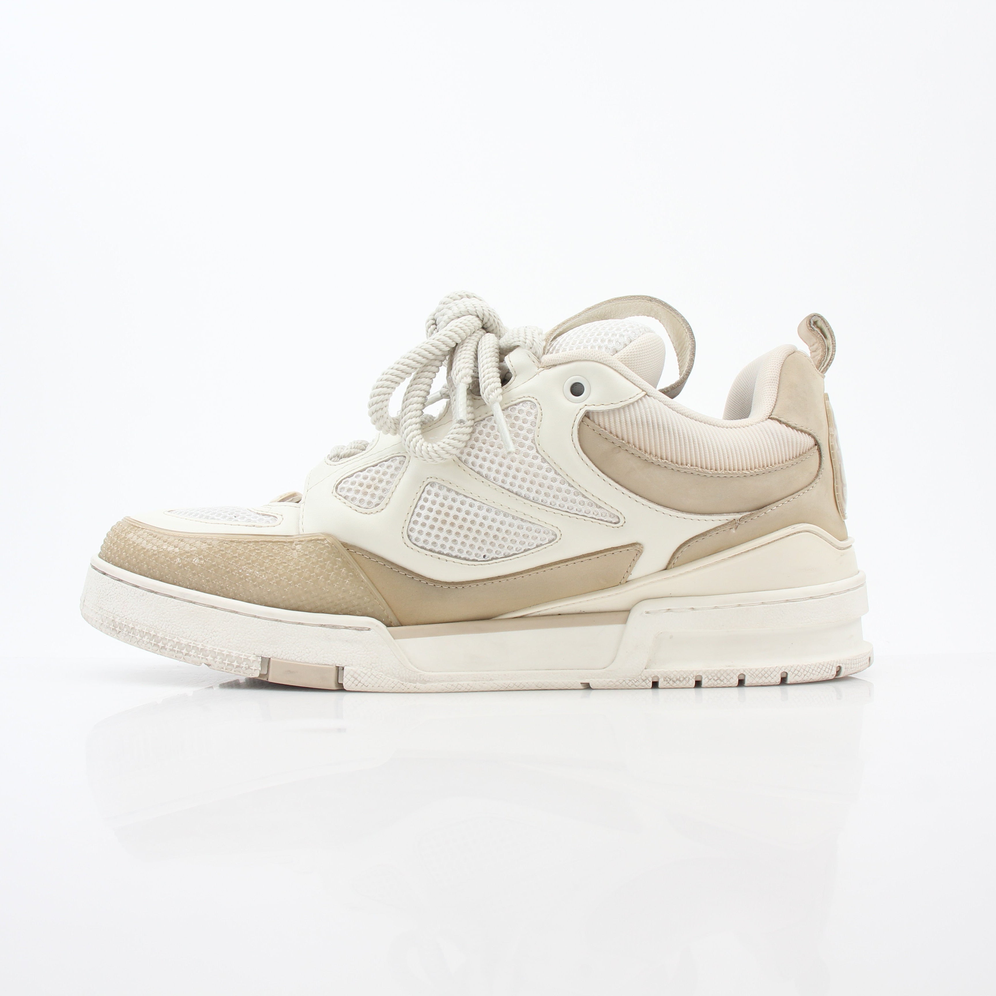 Louis Vuitton men's LV Skate sneaker in beige, stylish casual shoes with logo details and white rubber sole.