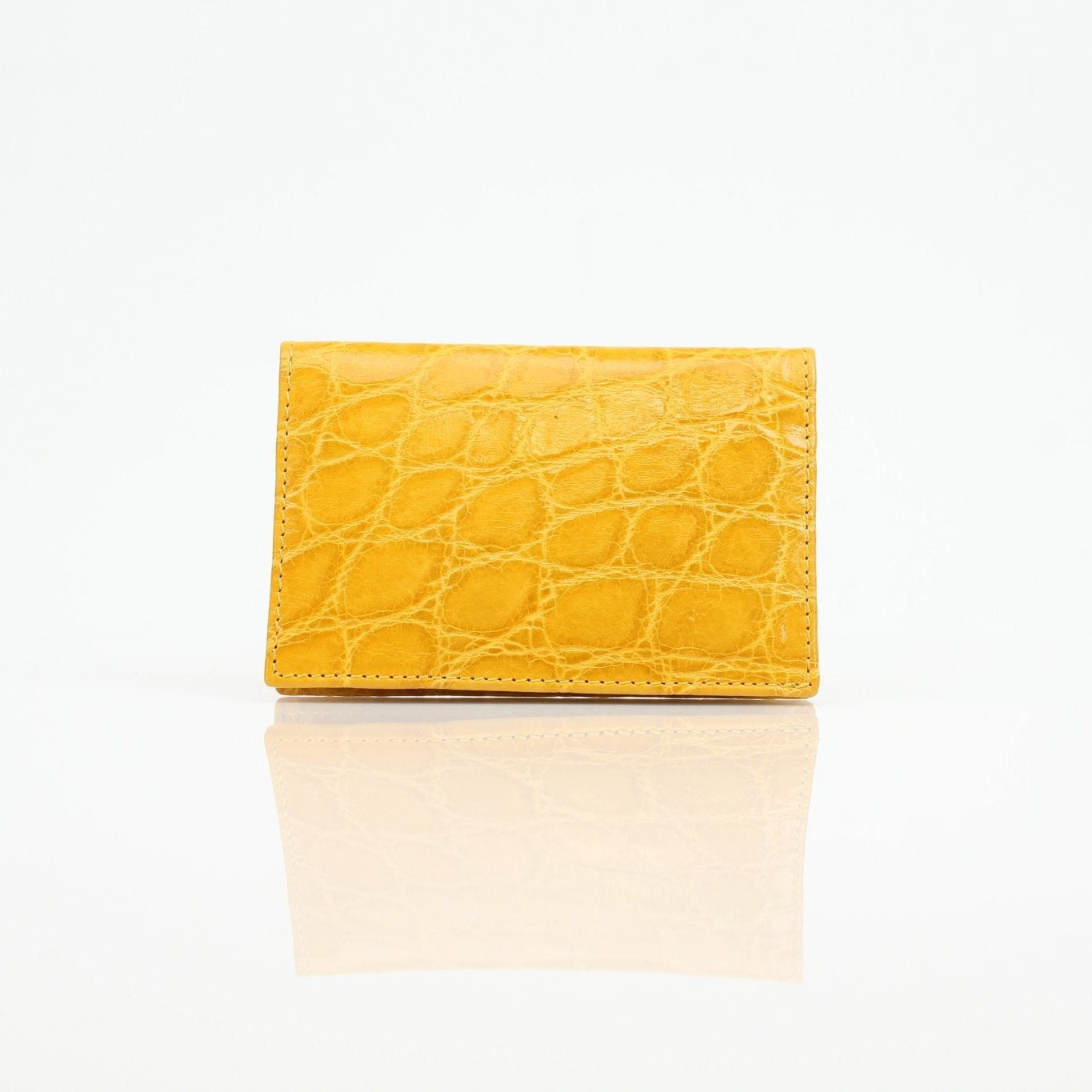 Gold & Beyond Bijan yellow crocodile leather wallet with a sleek design and textured crocodile pattern.