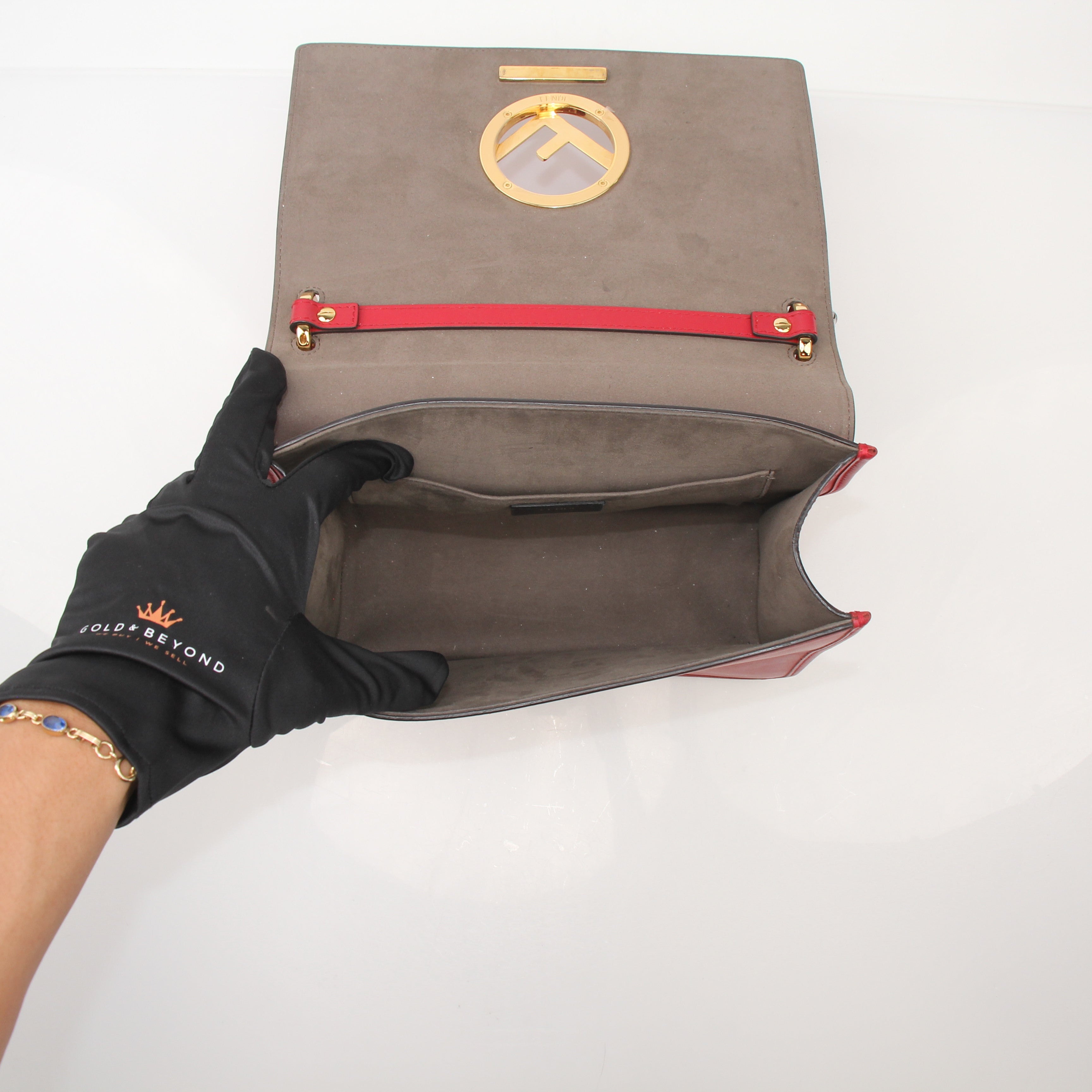Fendi Kan I F Logo Shoulder Bag handbag with gold hardware and signature logo detailing, displayed on a neutral background.