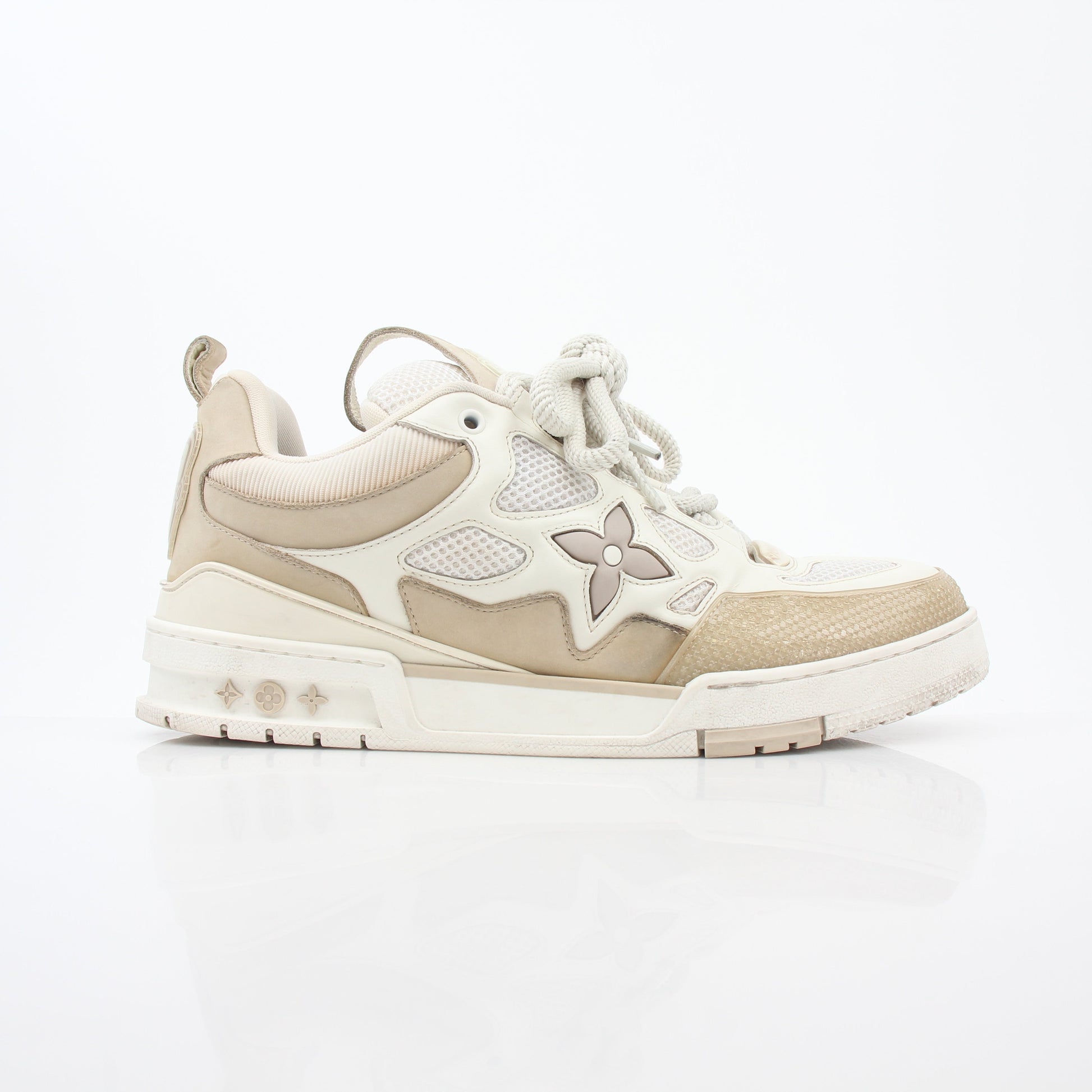 Louis Vuitton Men's LV Skate Sneaker in beige, stylish shoes with signature branding and casual athletic design.