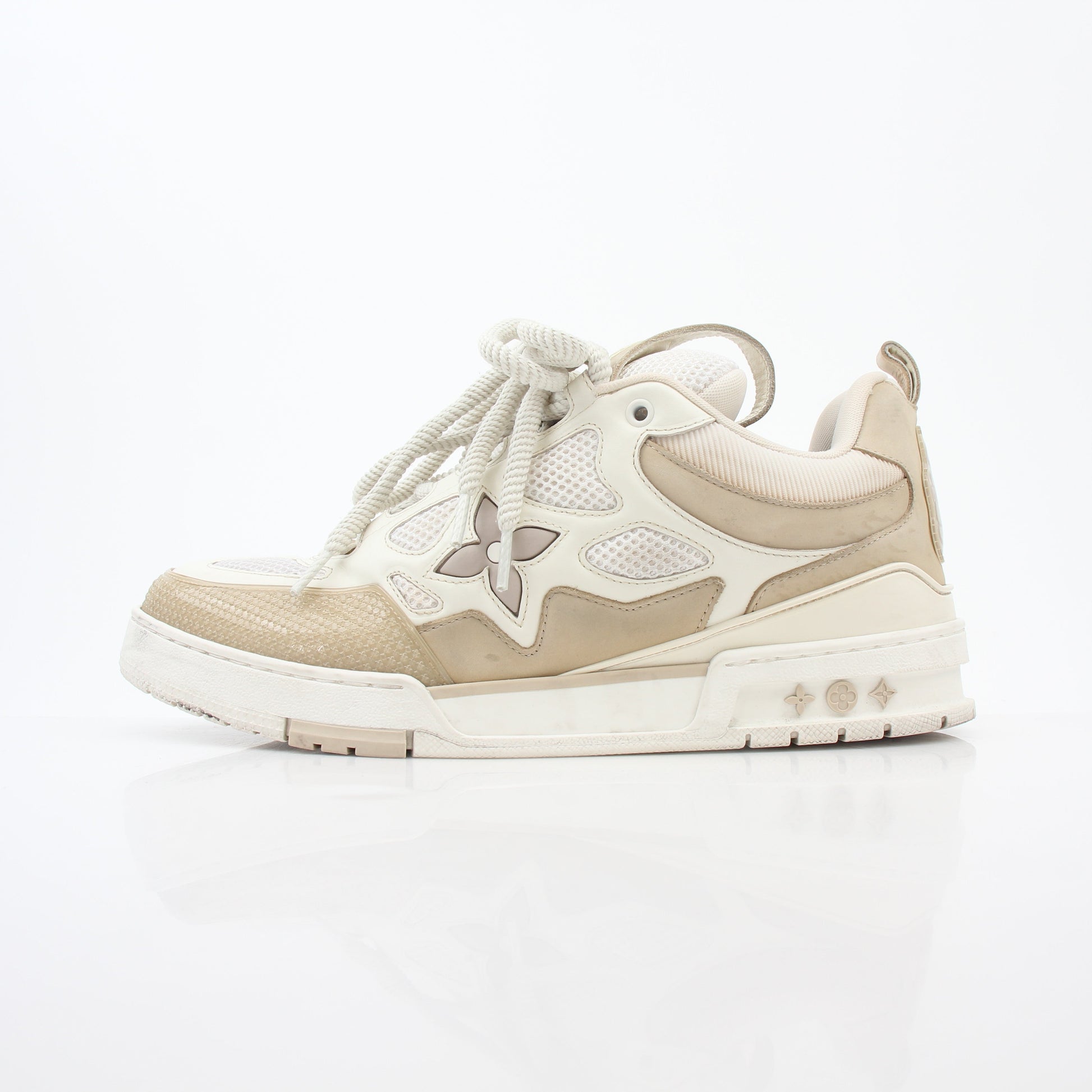 Louis Vuitton men's LV Skate sneaker in beige leather, showcasing stylish design and casual sneaker style from Gold & Beyond.