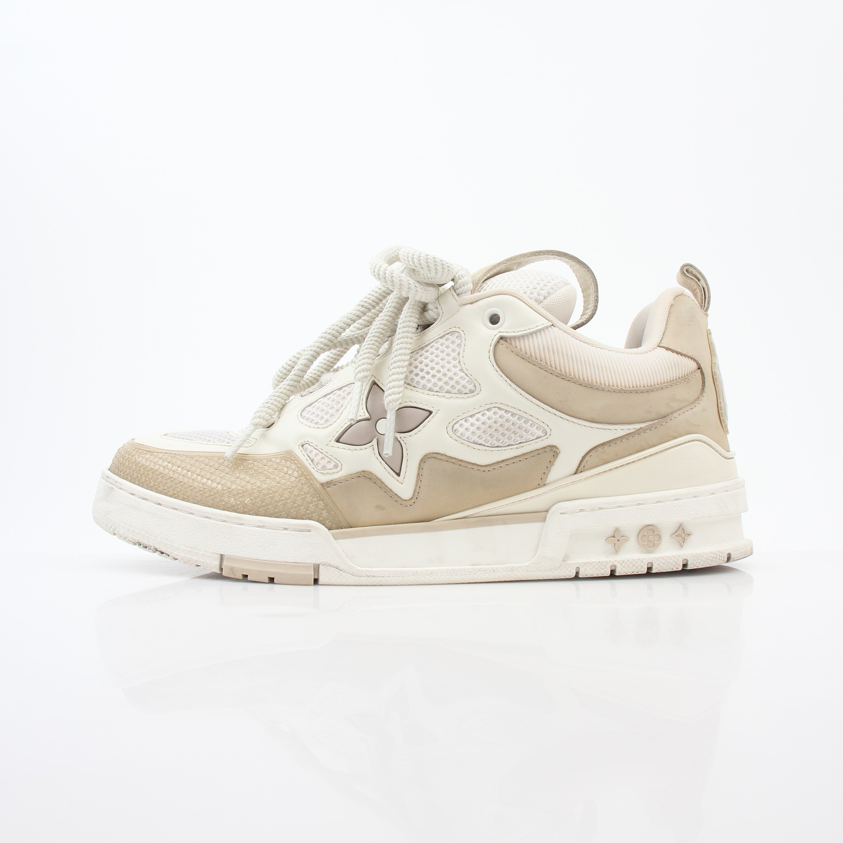 Louis Vuitton men's LV Skate sneaker in beige leather, showcasing stylish design and casual sneaker style from Gold & Beyond.