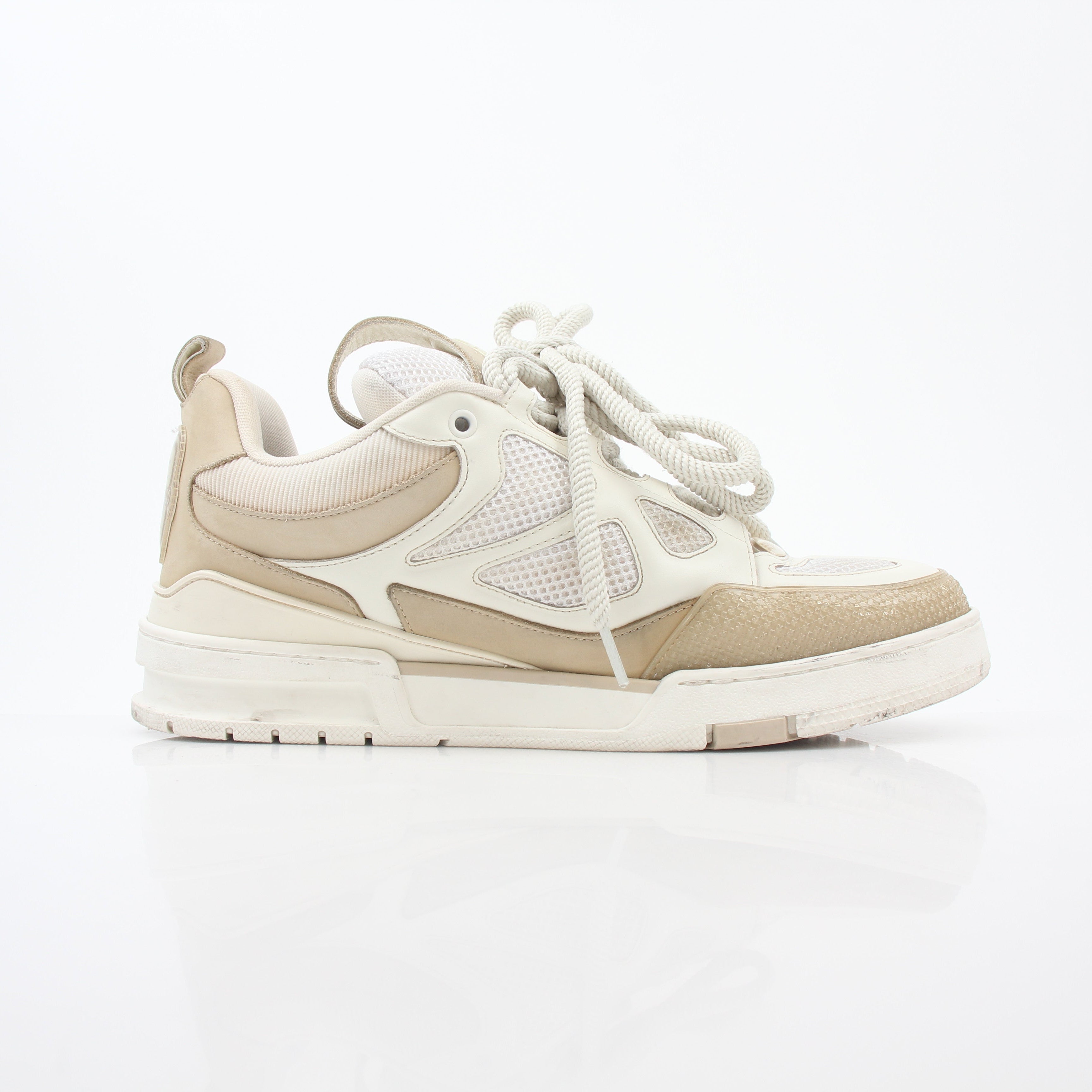 Louis Vuitton men's LV Skate sneaker in beige, featuring stylish design and branded details, displayed on a clean background.