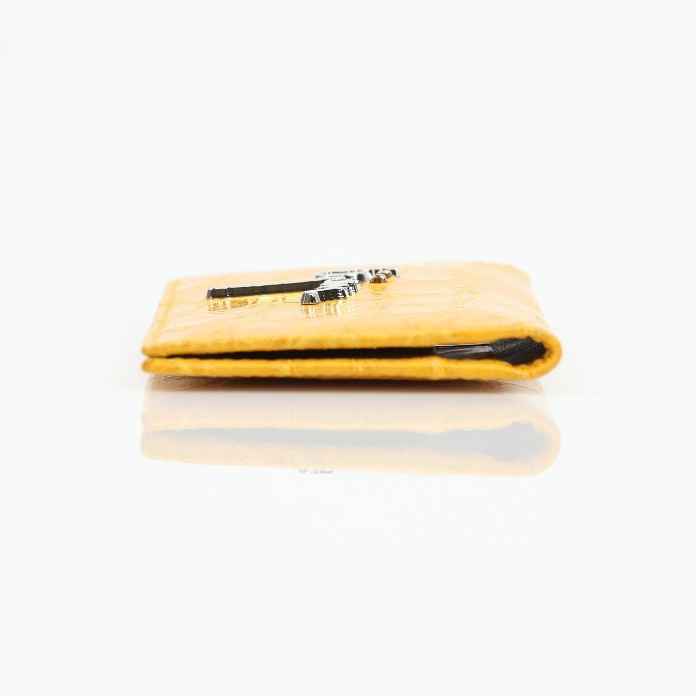 Gold & Beyond Bijan yellow crocodile wallet showing textured crocodile leather and gold-tone hardware on the exterior.