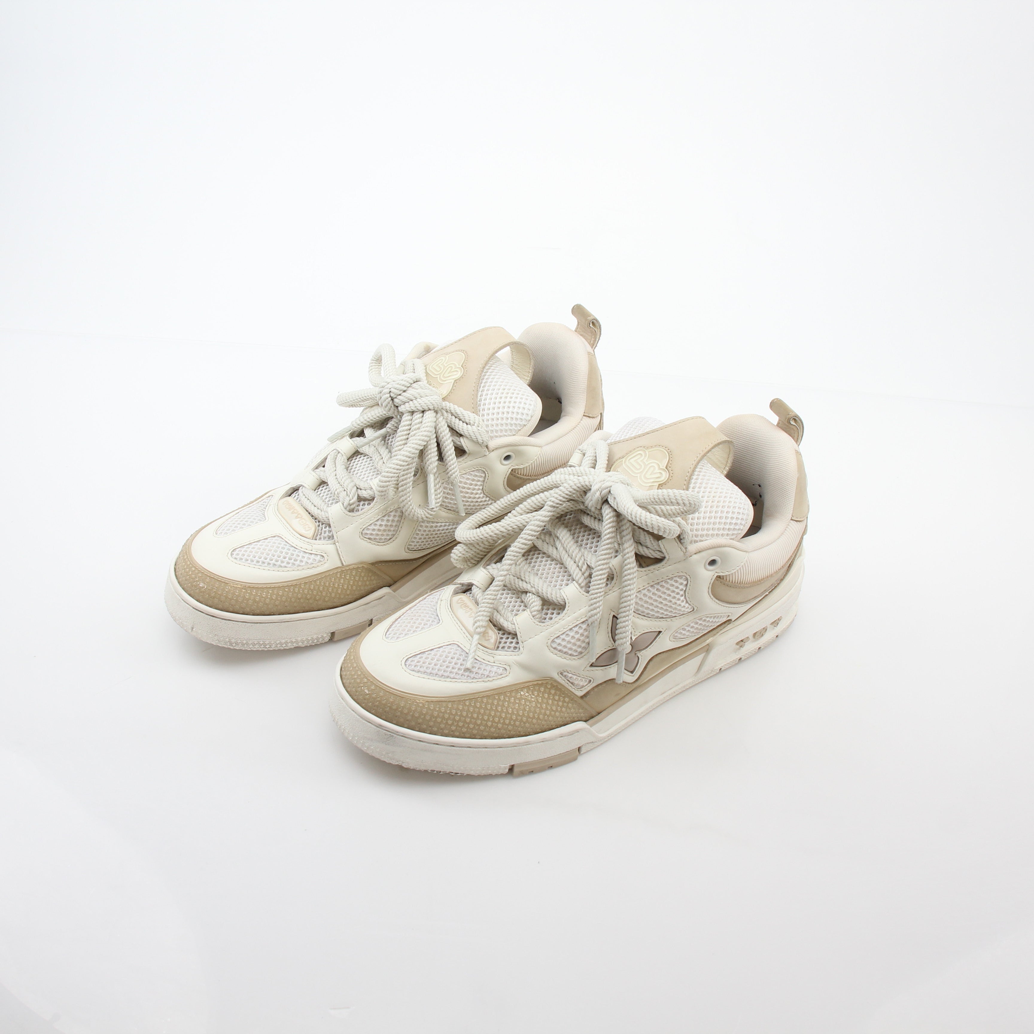 Louis Vuitton men's LV Skate sneaker in beige, stylish casual shoes with leather accents and skate-inspired design.