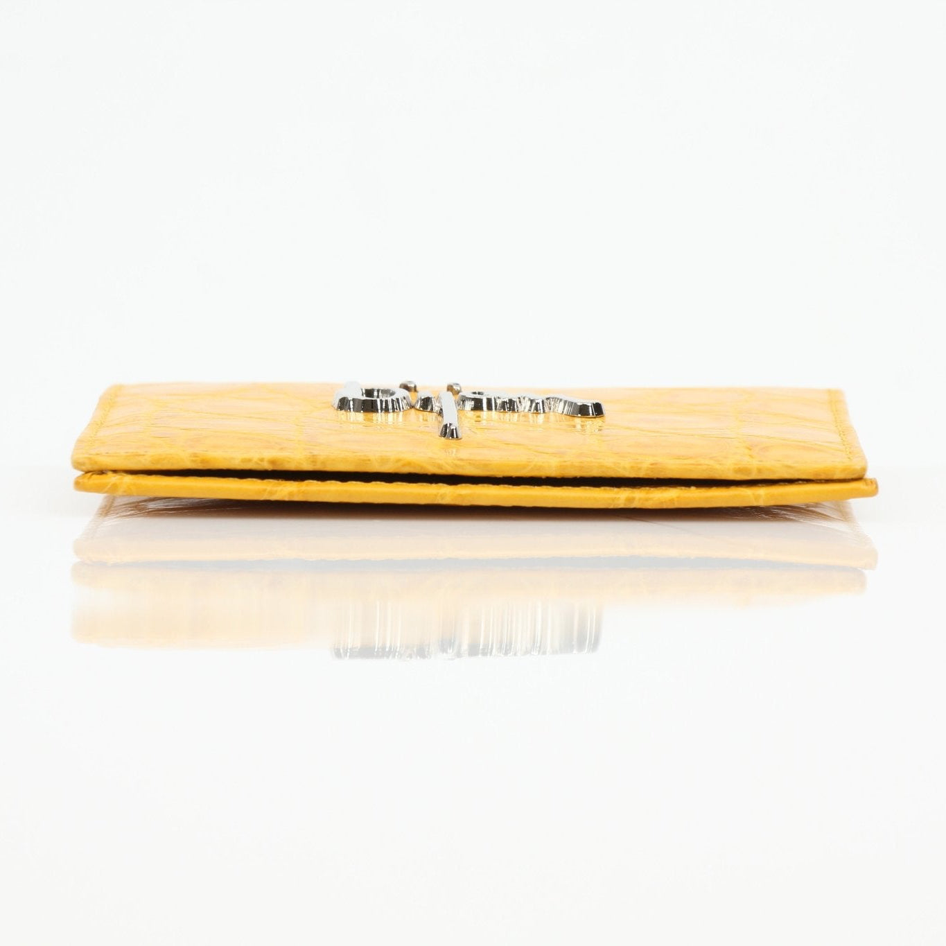 Gold & Beyond Bijan yellow crocodile leather wallet with textured pattern and multiple card slots.