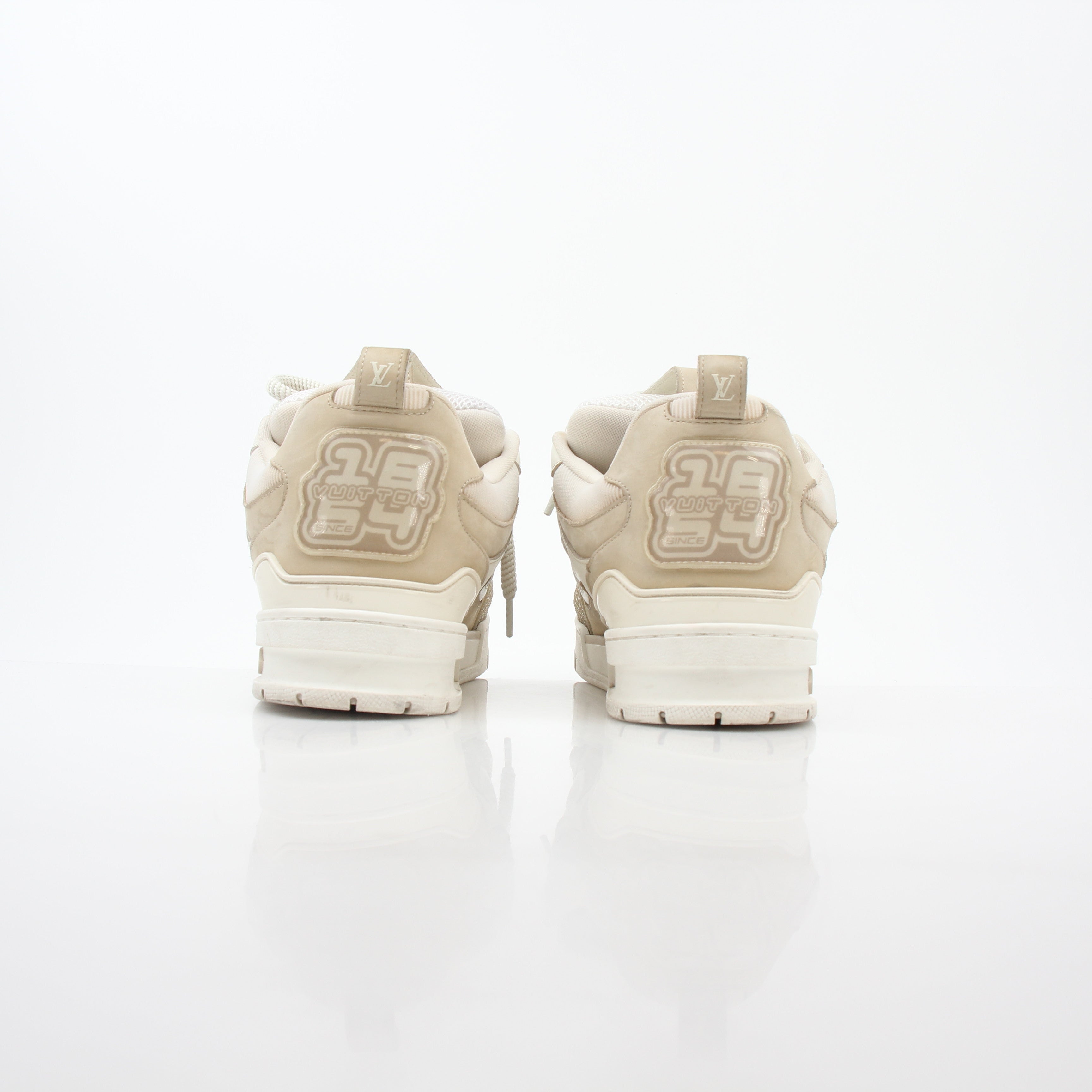 Louis Vuitton men's LV Skate Sneaker in beige, stylish shoes with LV branding and skate-inspired design.