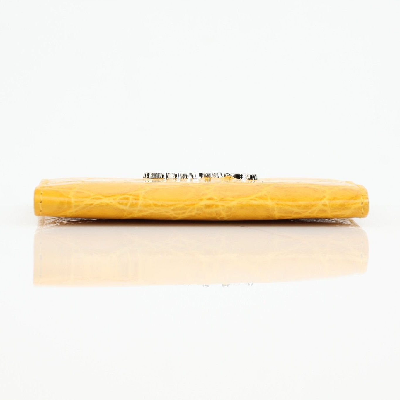 Gold & Beyond Bijan yellow crocodile leather wallet with textured crocodile pattern and gold-tone clasp.