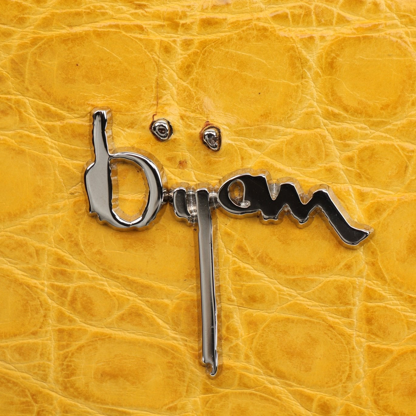 Yellow crocodile leather wallet from Gold & Beyond with a sleek, textured design and compact size.