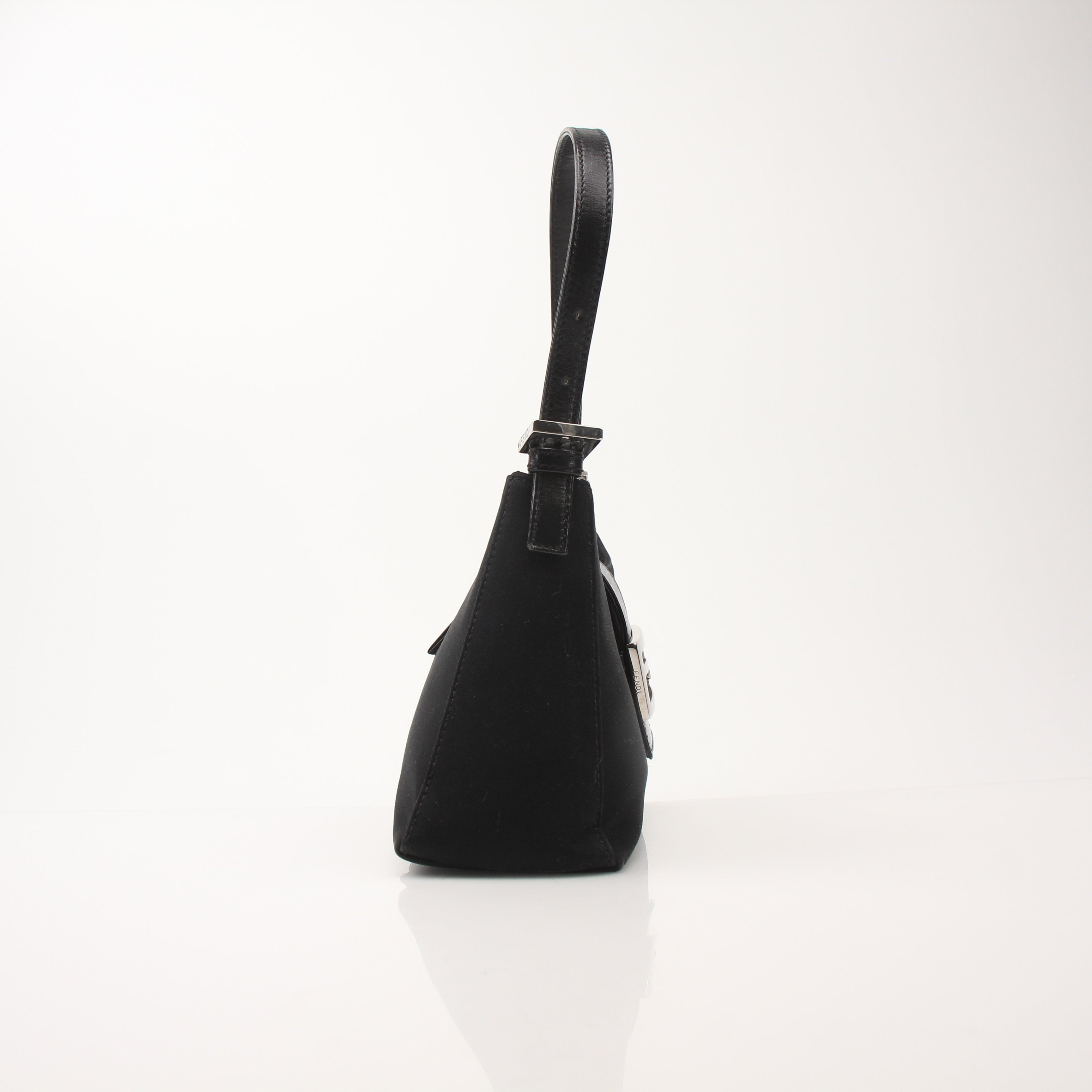 Black neoprene Fendi Baguette shoulder bag with gold accents, stylish handbag with a sleek, modern design.