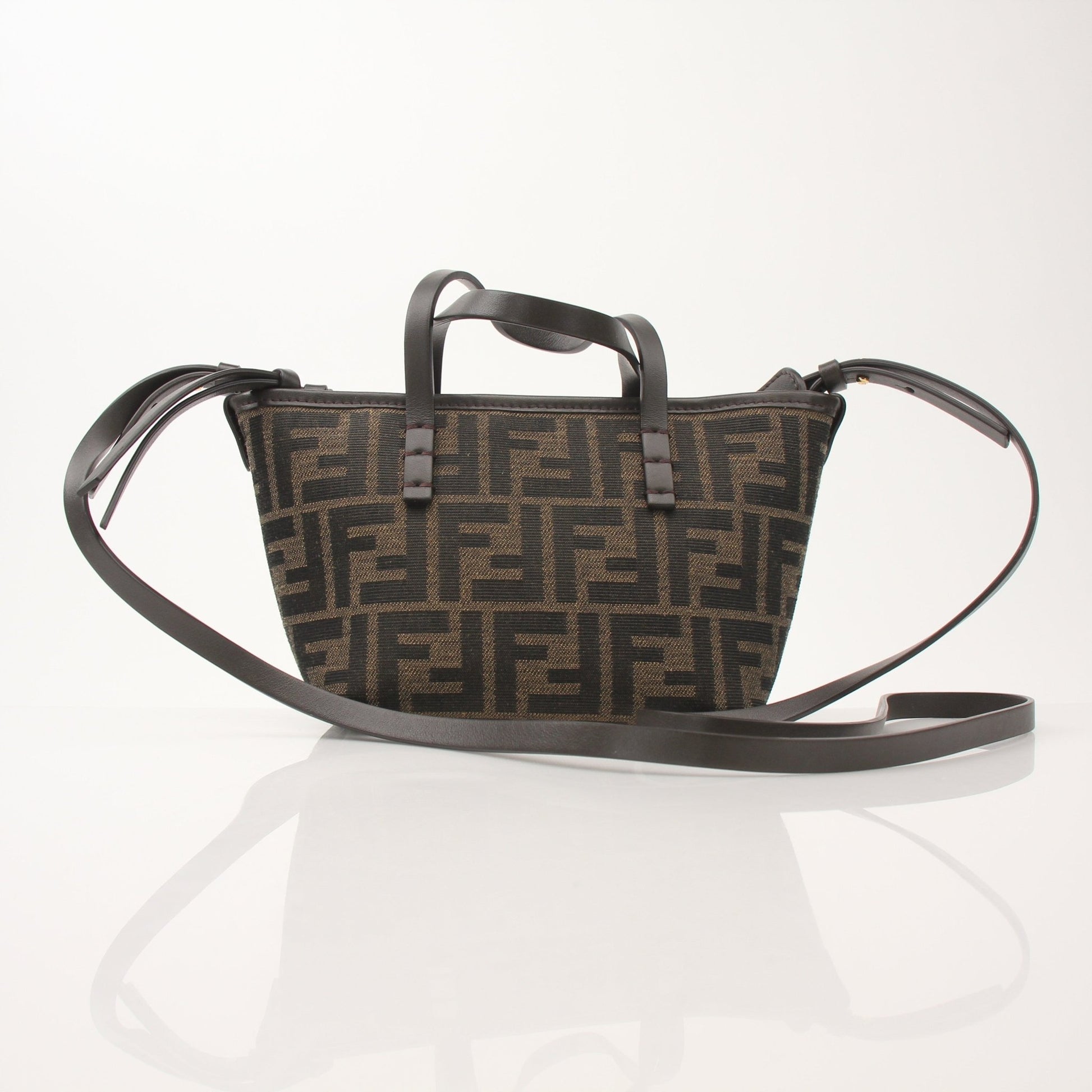 Gold & Beyond Fendi FF Jacquard Mini Roll Bag handbag with signature logo pattern and gold-tone details.