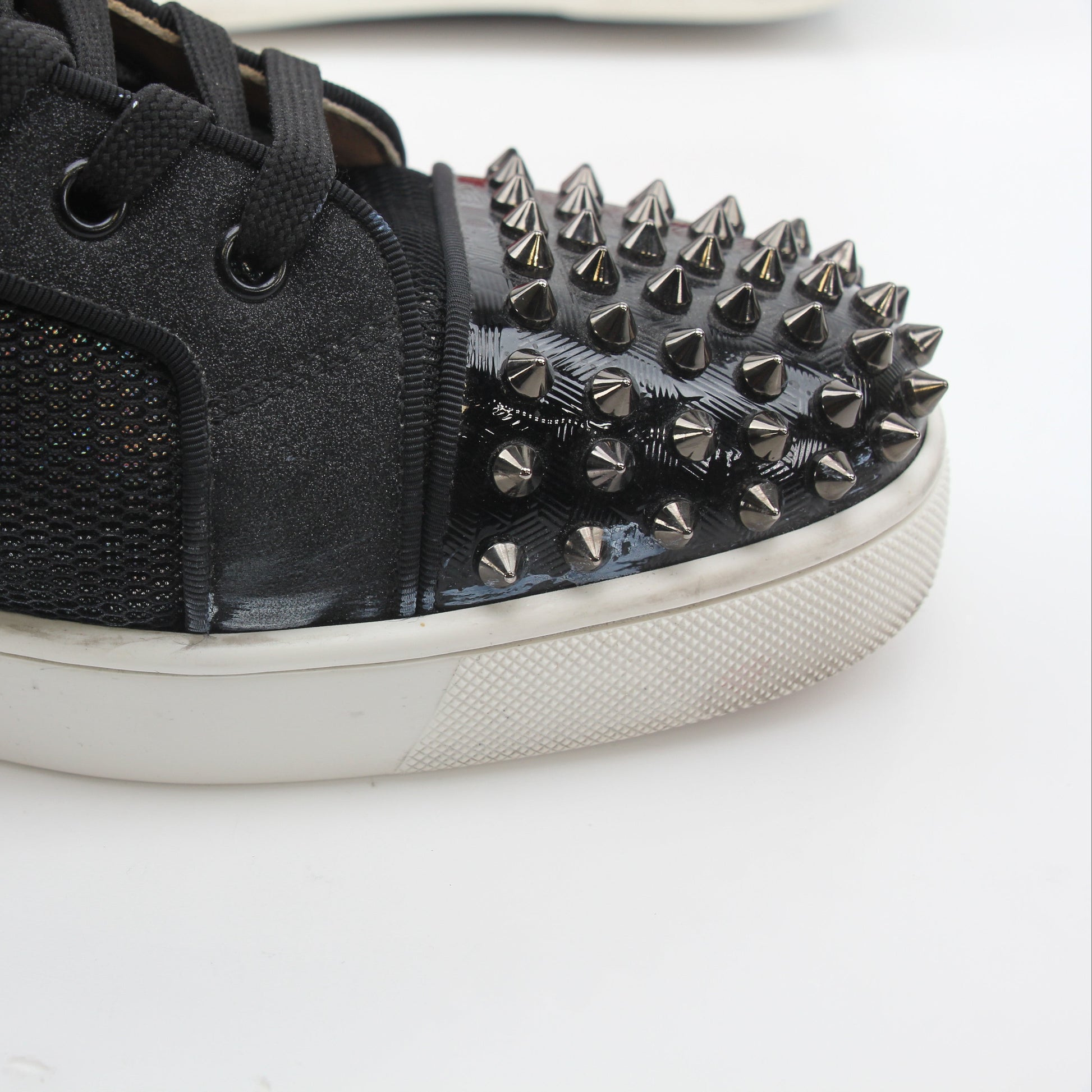 Christian Louboutin men's Lou Spikes Orlato black high-top sneakers with spike details and sleek design, featuring signature style.