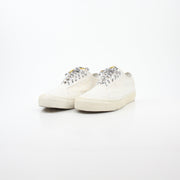 Vans x Rhude Diamo Ni Bandana White sneakers with classic shoe design and bandana pattern on the shoes, shown from a side view.