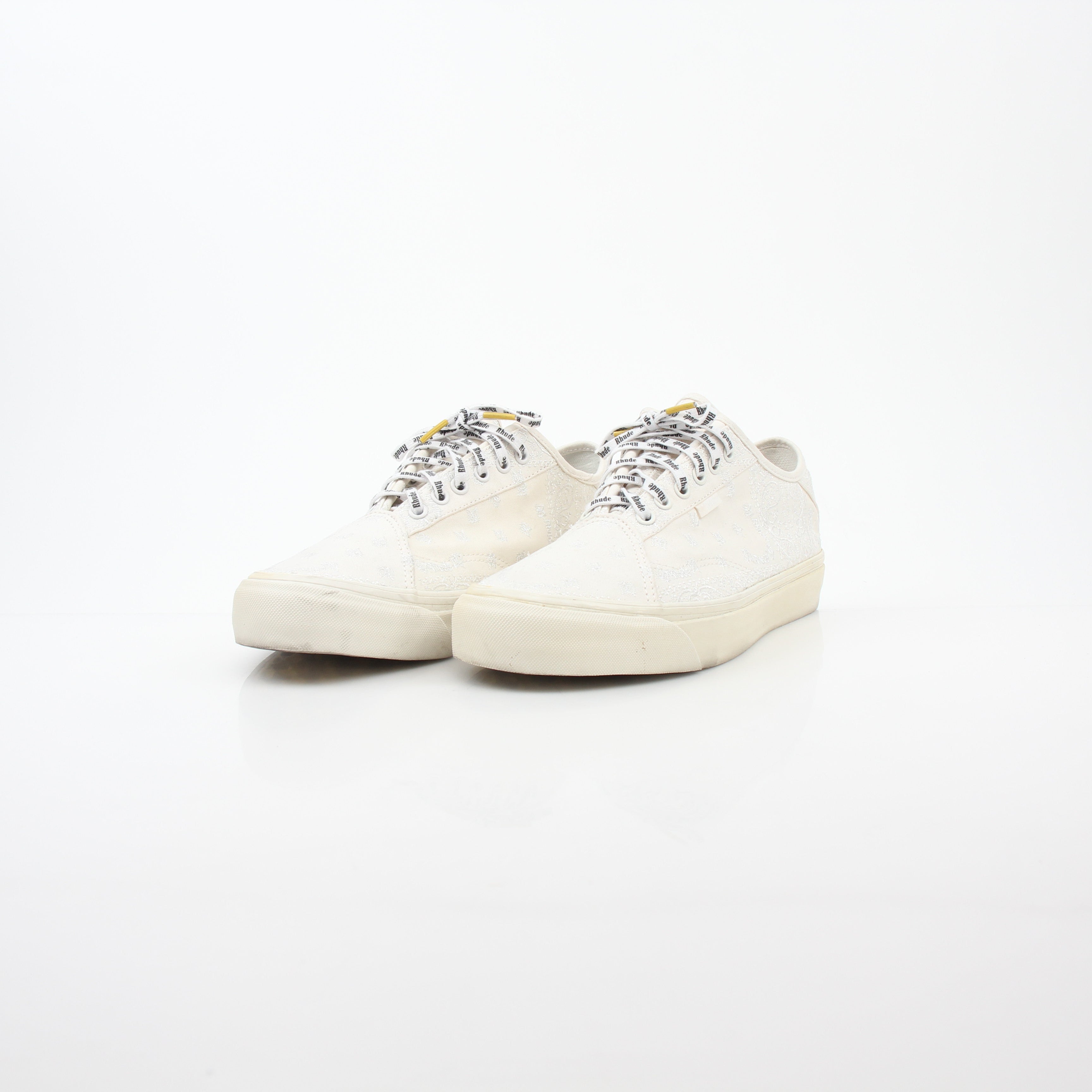 Vans x Rhude Diamo Ni Bandana White sneakers with classic shoe design and bandana pattern on the shoes, shown from a side view.