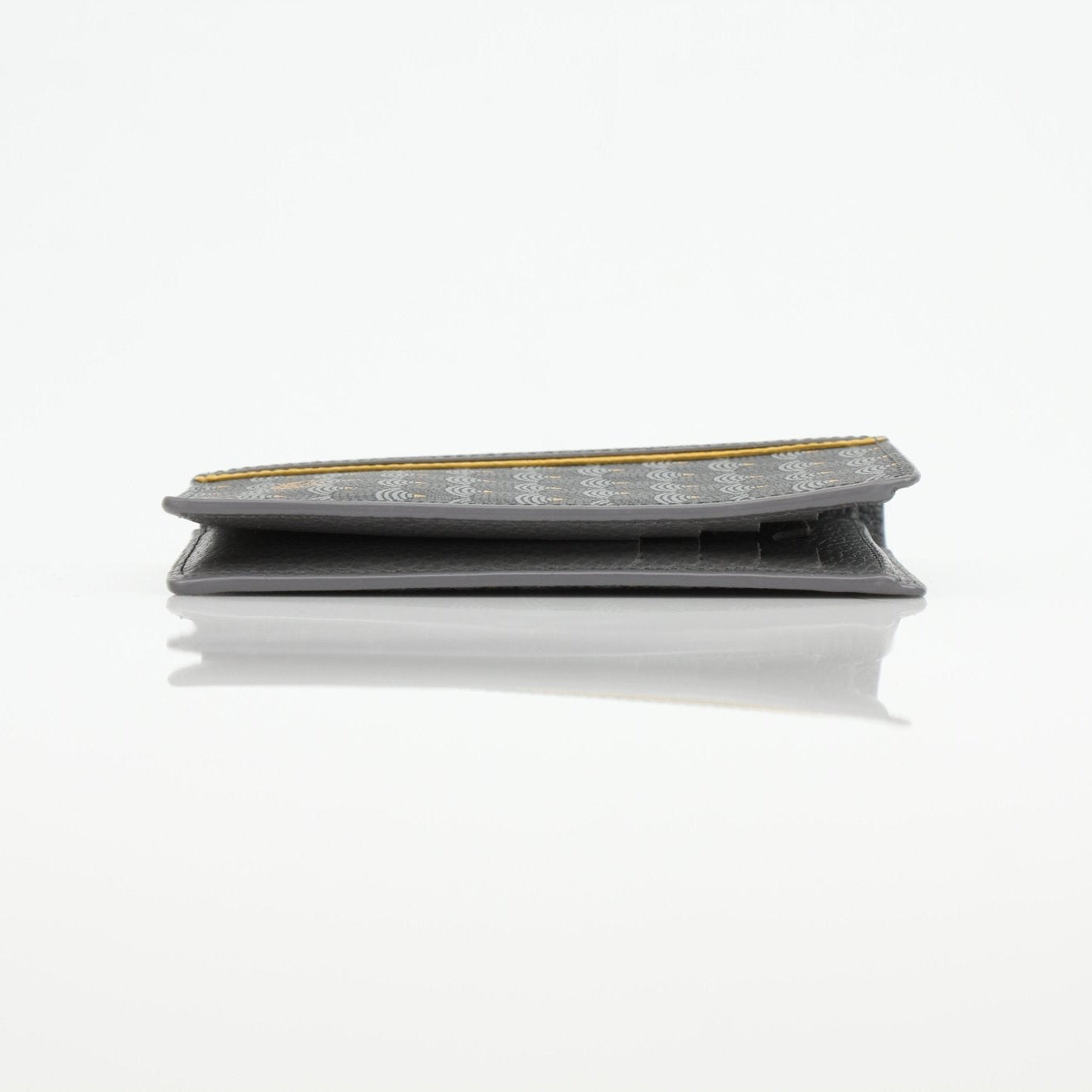 Faure Le Page Scale Canvas Wallet by Gold & Beyond showing the textured wallet with scale pattern and multiple card slots.