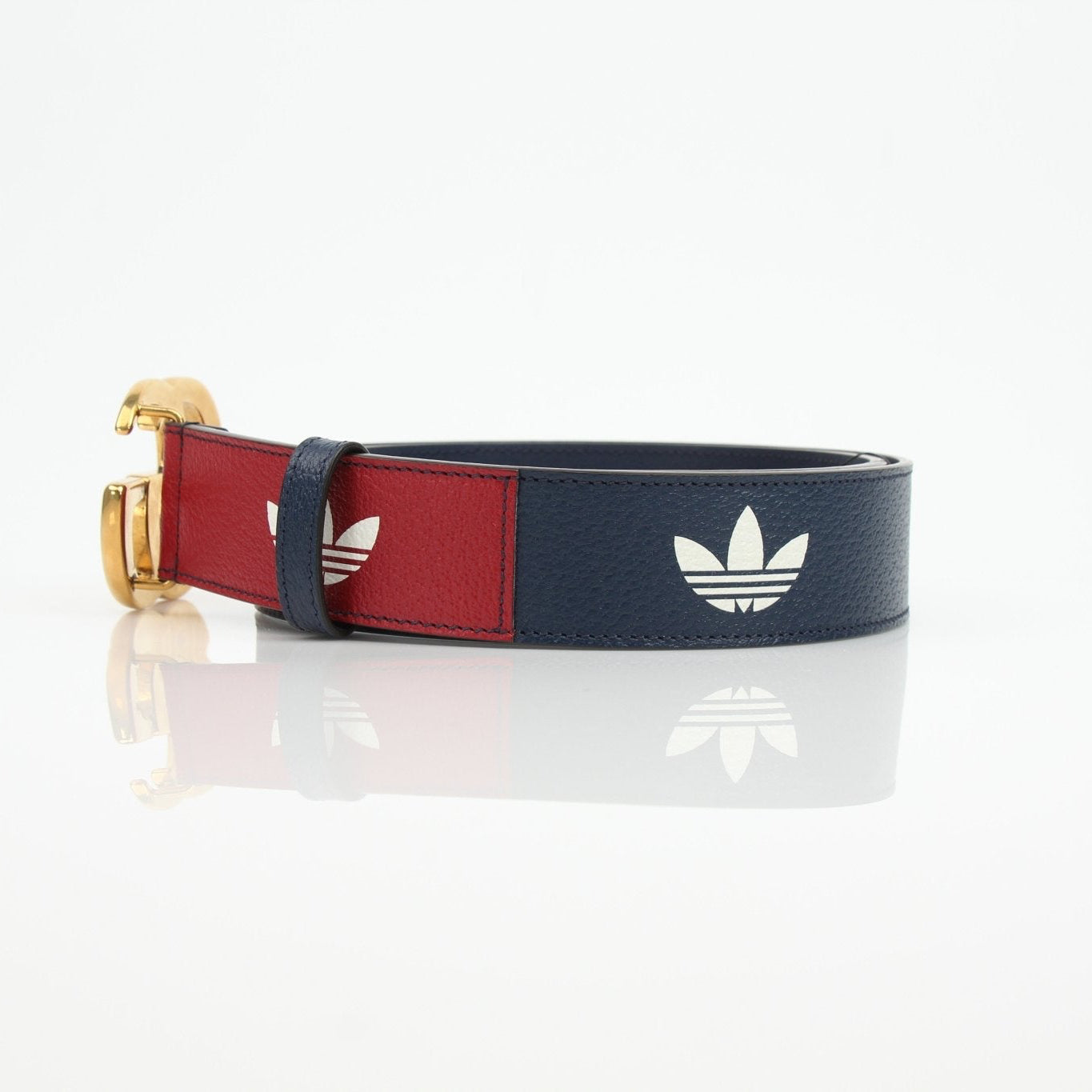 Gold & Beyond Gucci Adidas Marmont belt accessory with gold-tone hardware and signature design, laid flat on a neutral background.