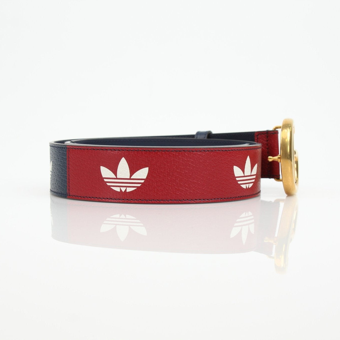 Gucci Adidas Marmont belt in accessories, featuring gold hardware and distinctive design, displayed on a neutral background.