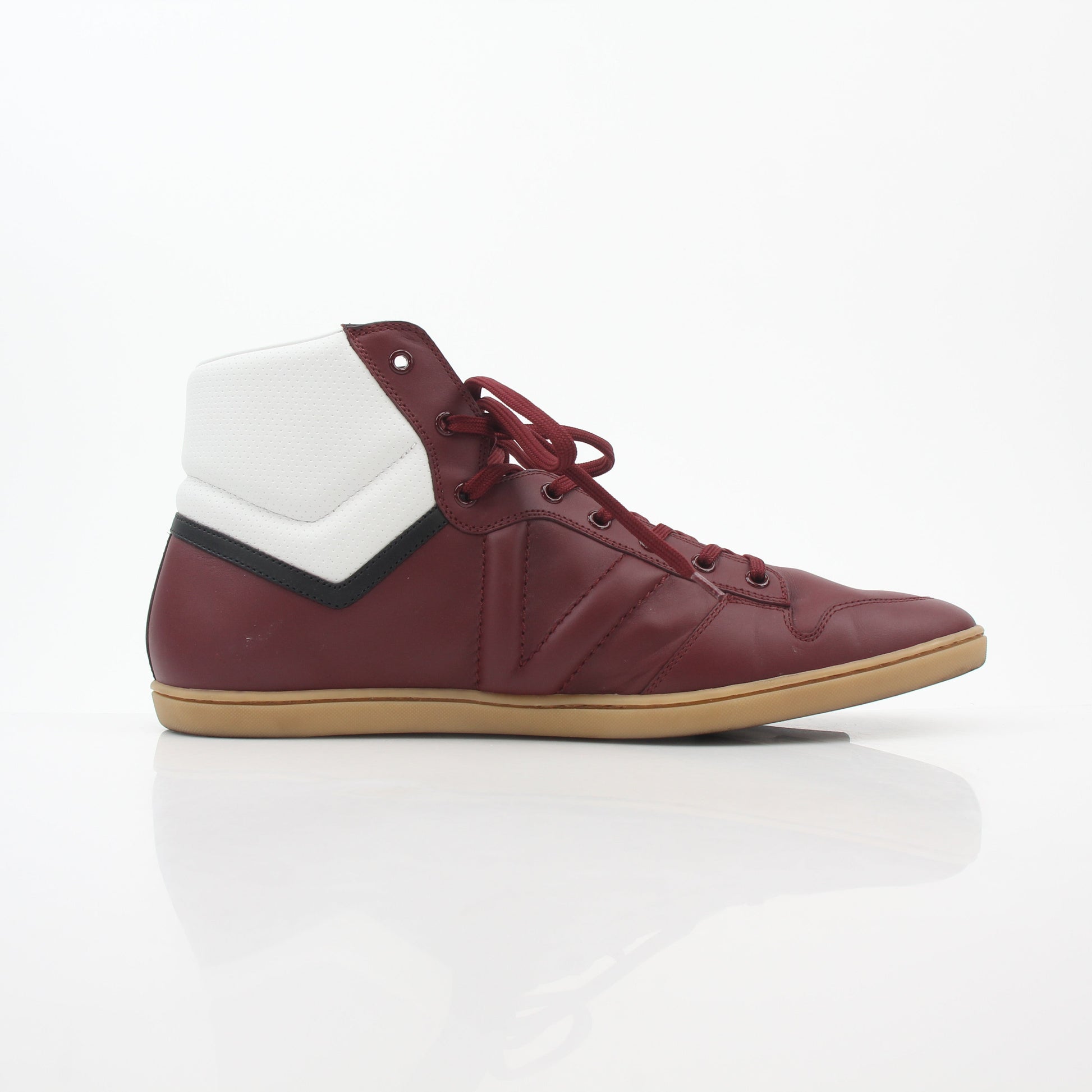 Louis Vuitton Burgundy Spitfire high-top sneakers by Gold & Beyond showing the stylish burgundy leather shoes with white soles and laces.