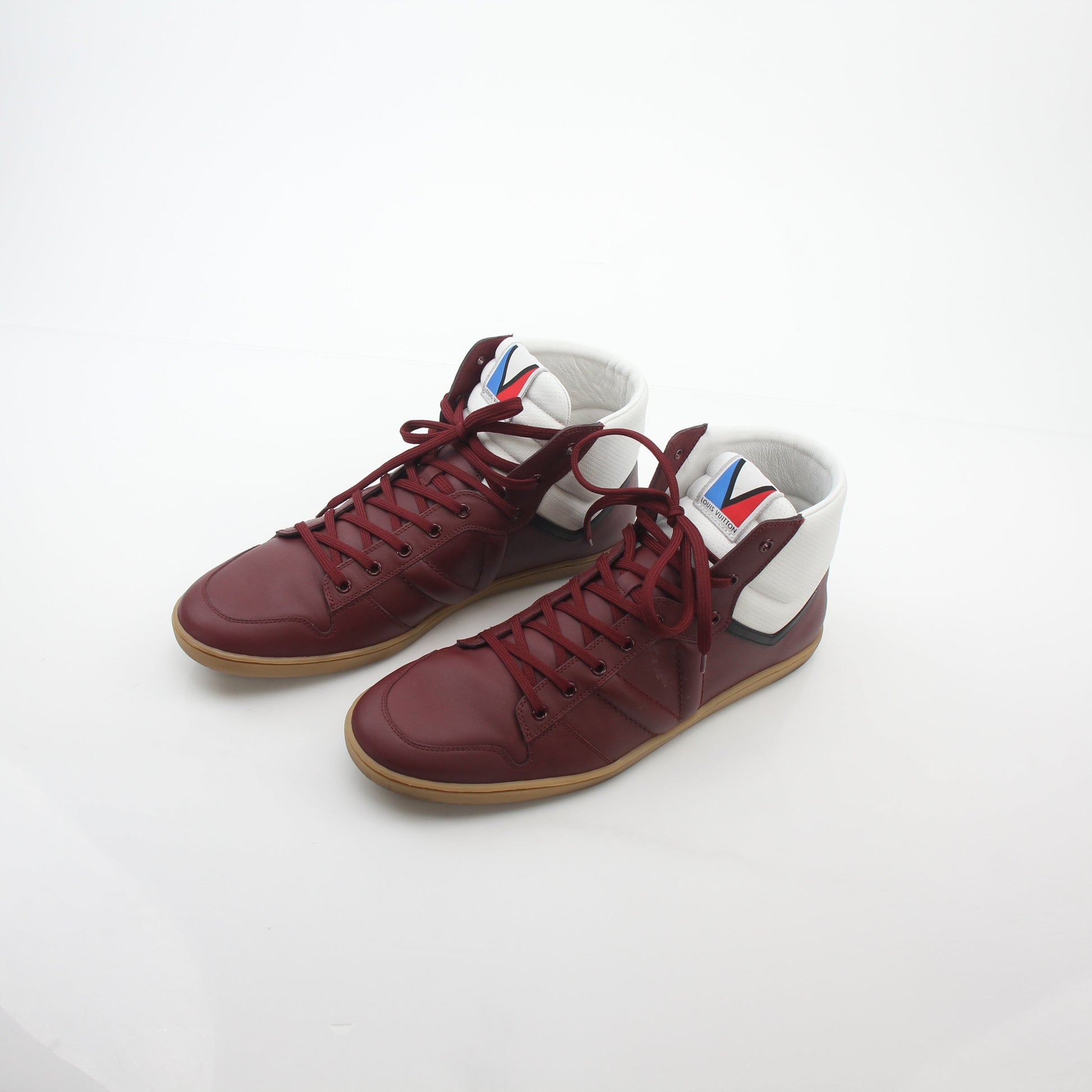 Louis Vuitton Burgundy Spitfire high-top sneakers by Gold & Beyond, featuring leather material and stylish design.