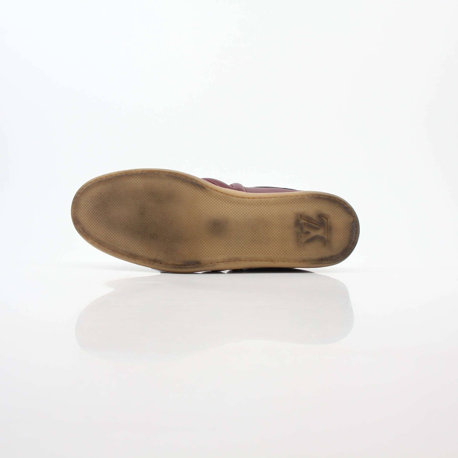 Gold & Beyond Burgundy Louis Vuitton Spitfire high-top sneakers with logo details and white rubber soles.