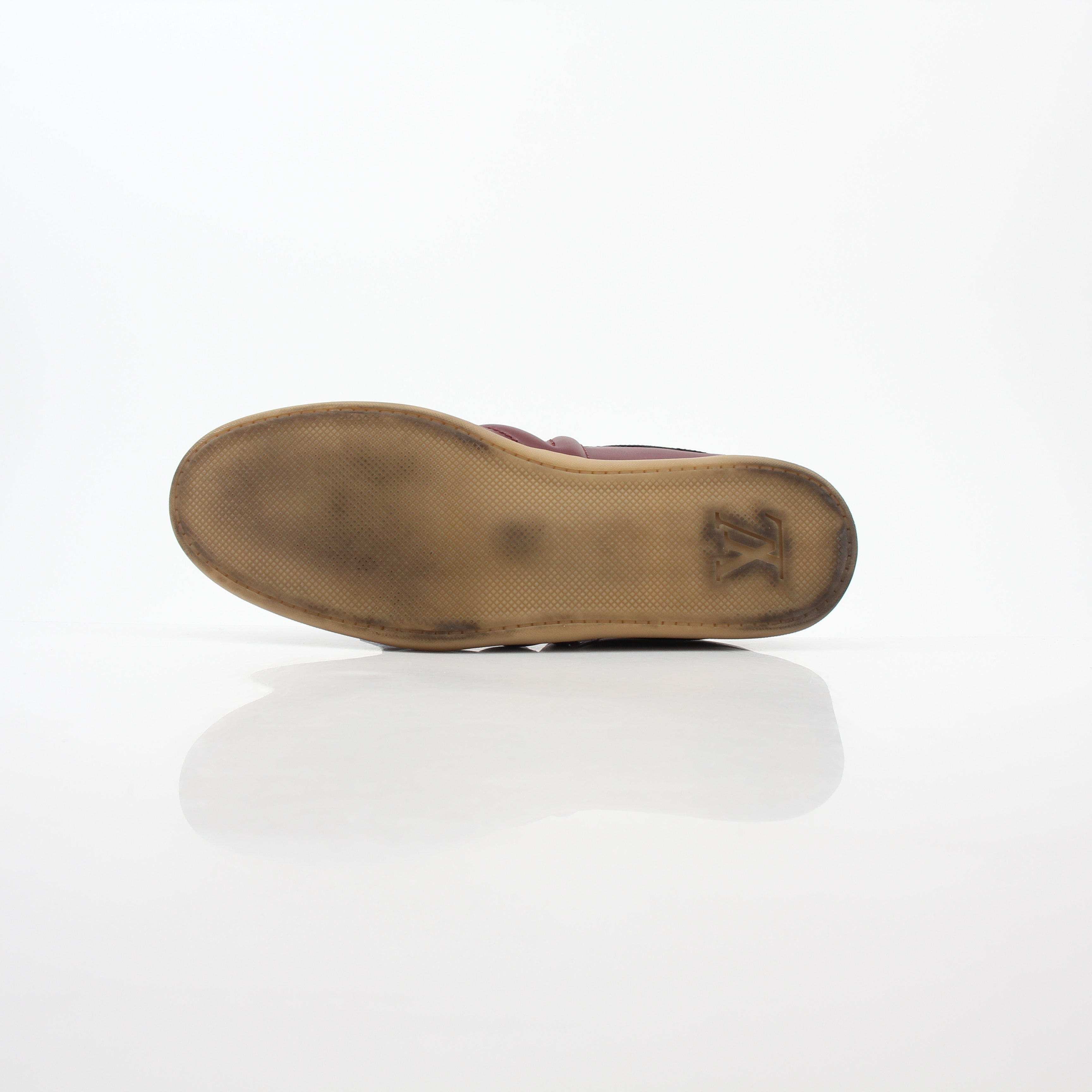 Gold & Beyond Burgundy Louis Vuitton Spitfire high-top sneakers with logo details and white rubber soles.
