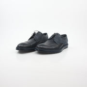 Louis Vuitton black and charcoal Damier suede derby shoes with sleek design and detailed stitching.