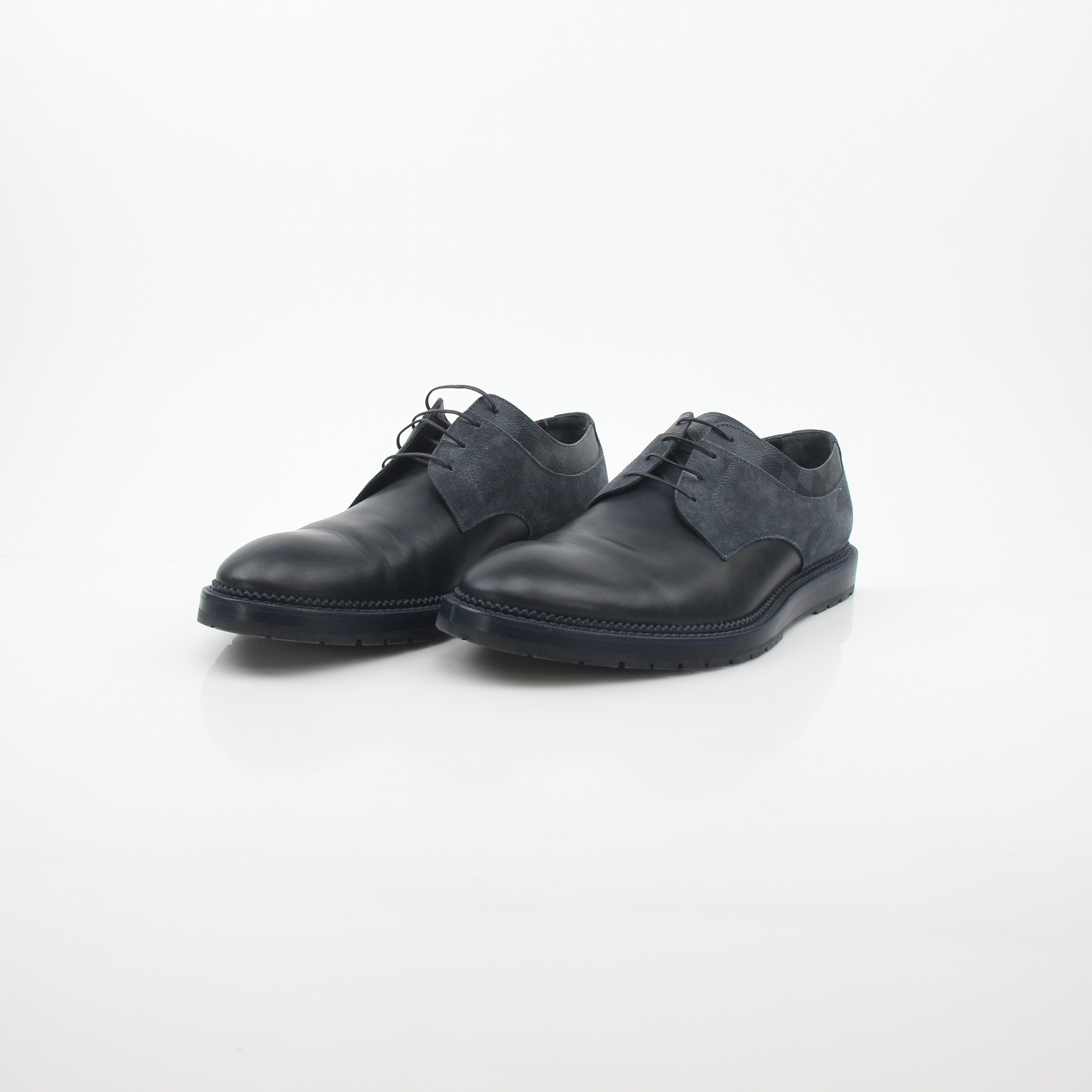 Louis Vuitton black and charcoal Damier suede derby shoes with sleek design and detailed stitching.