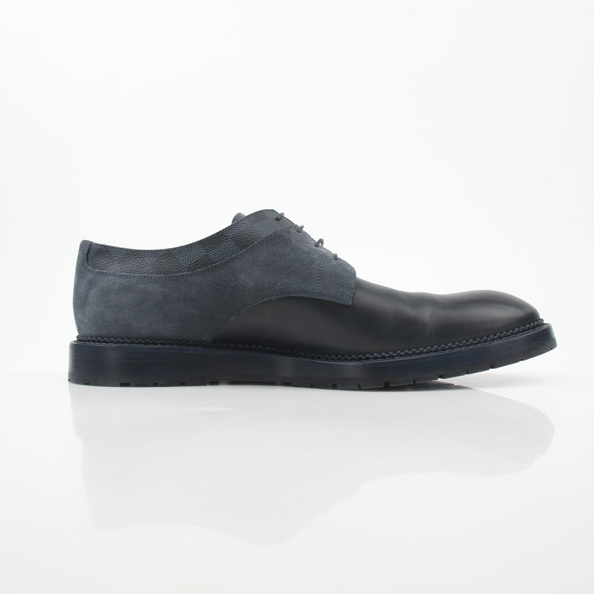Louis Vuitton Damier suede derby shoes in black and charcoal with classic pattern, leather soles, and elegant design.