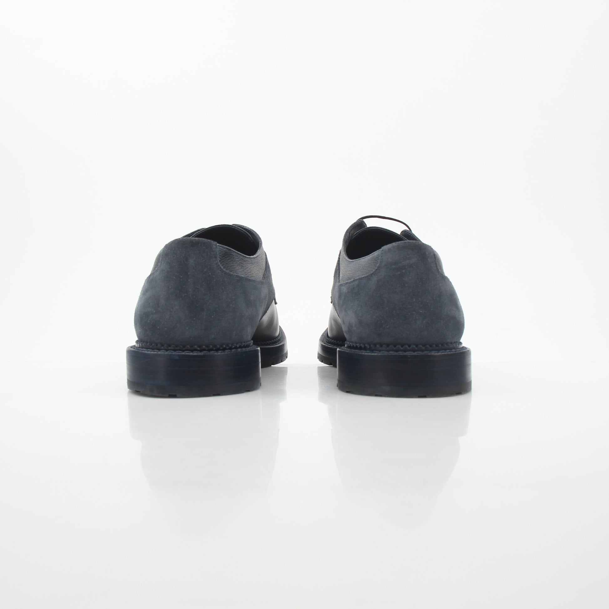 Louis Vuitton black and charcoal Damier suede derby shoes with classic lace-up design and sleek silhouette.