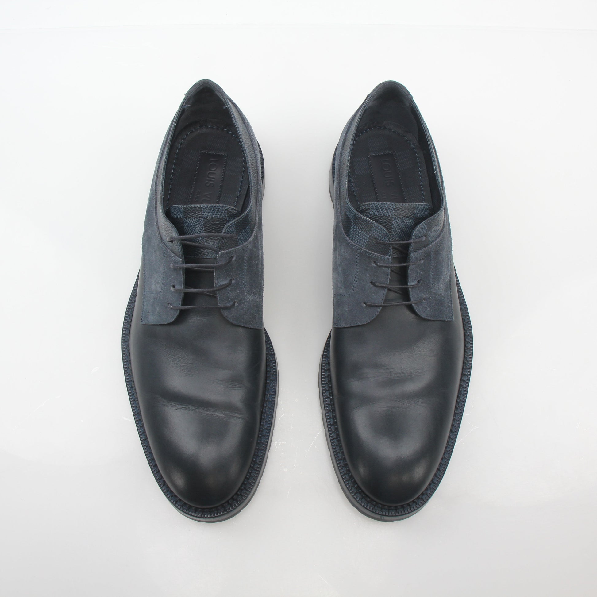 Louis Vuitton black and charcoal Damier suede derby shoes with sleek design and laced closure, displayed on a plain background.