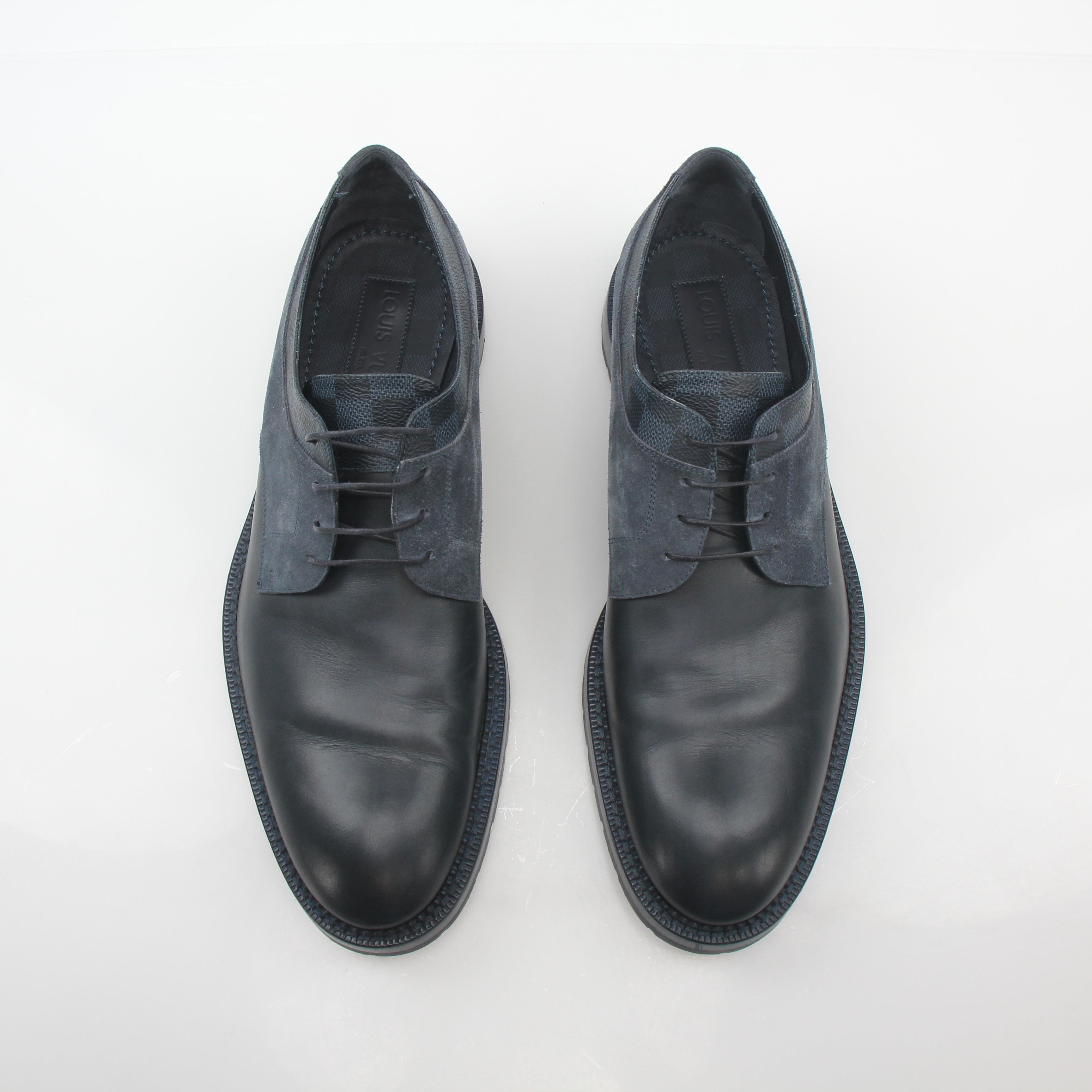 Louis Vuitton black and charcoal Damier suede derby shoes with sleek design and laced closure, displayed on a plain background.