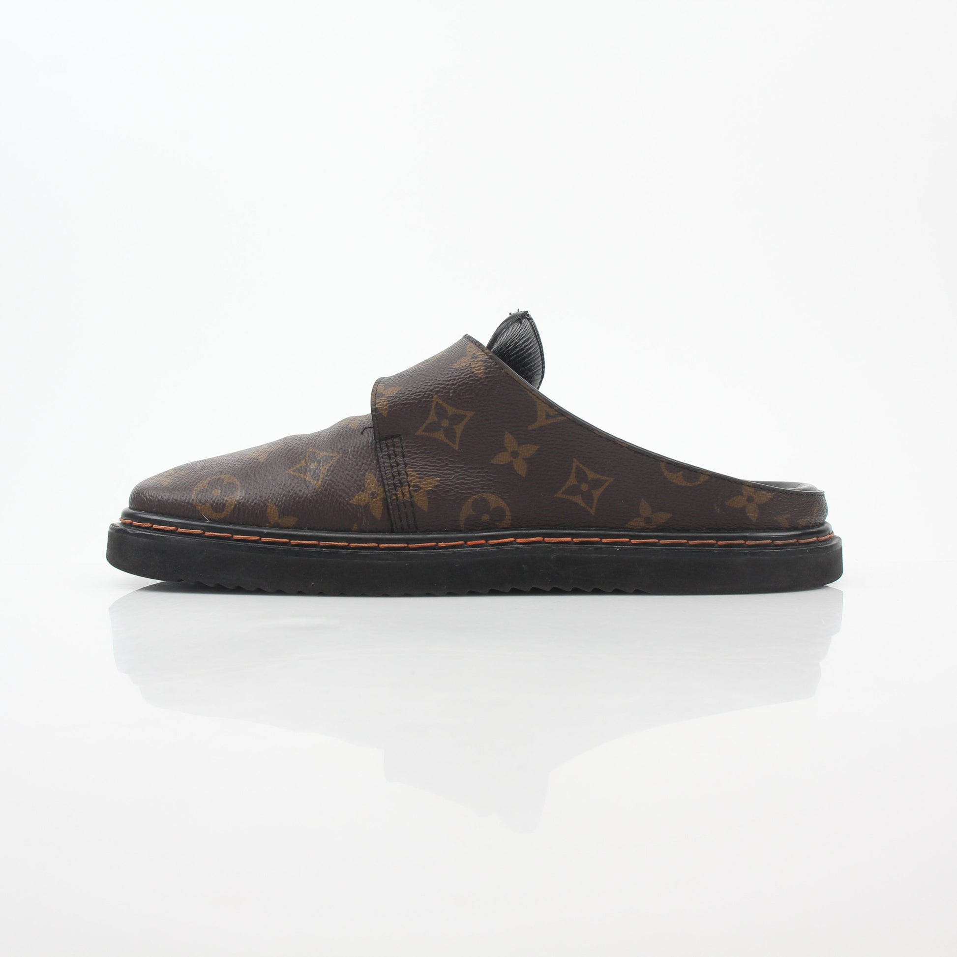 Louis Vuitton Monogram LV Line Mule Shoes featuring classic monogram pattern and stylish slip-on design from Gold & Beyond.