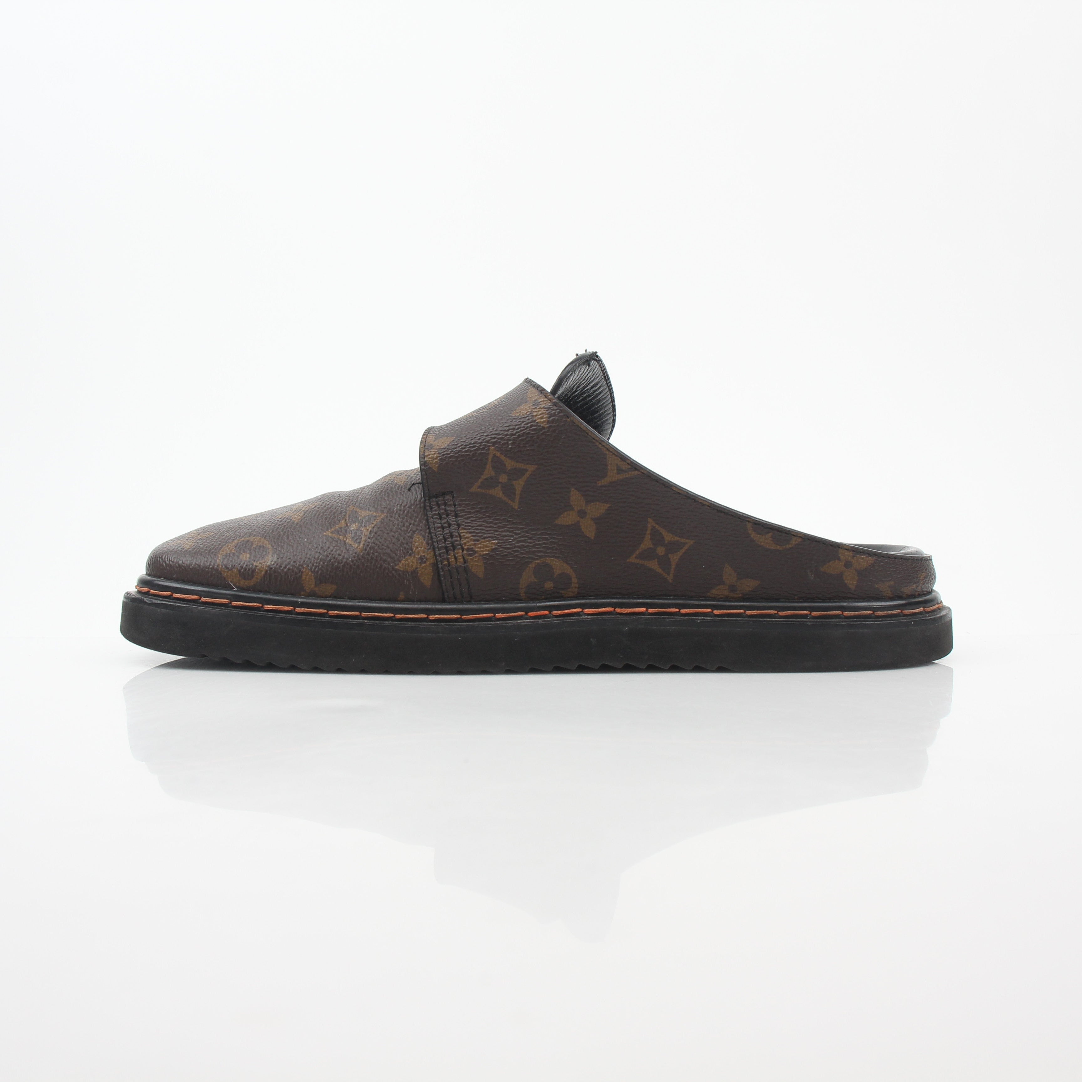 Louis Vuitton Monogram LV Line Mule Shoes featuring classic monogram pattern and stylish slip-on design from Gold & Beyond.