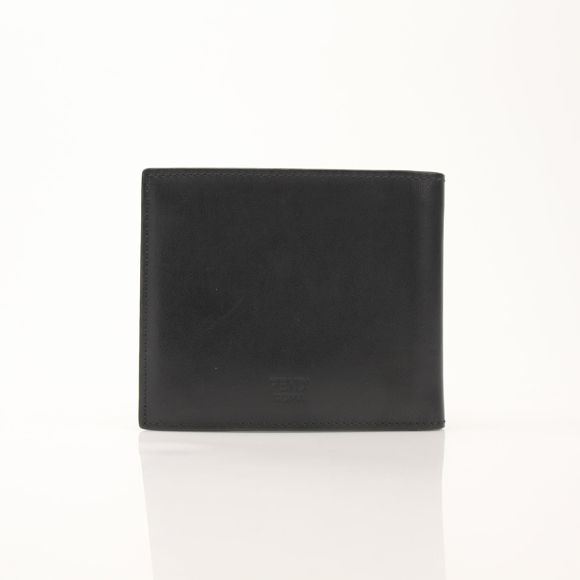 Fendi Vitello Century metal-eyed bi-fold wallet in leather with gold accents, featuring distinctive monster eye design.