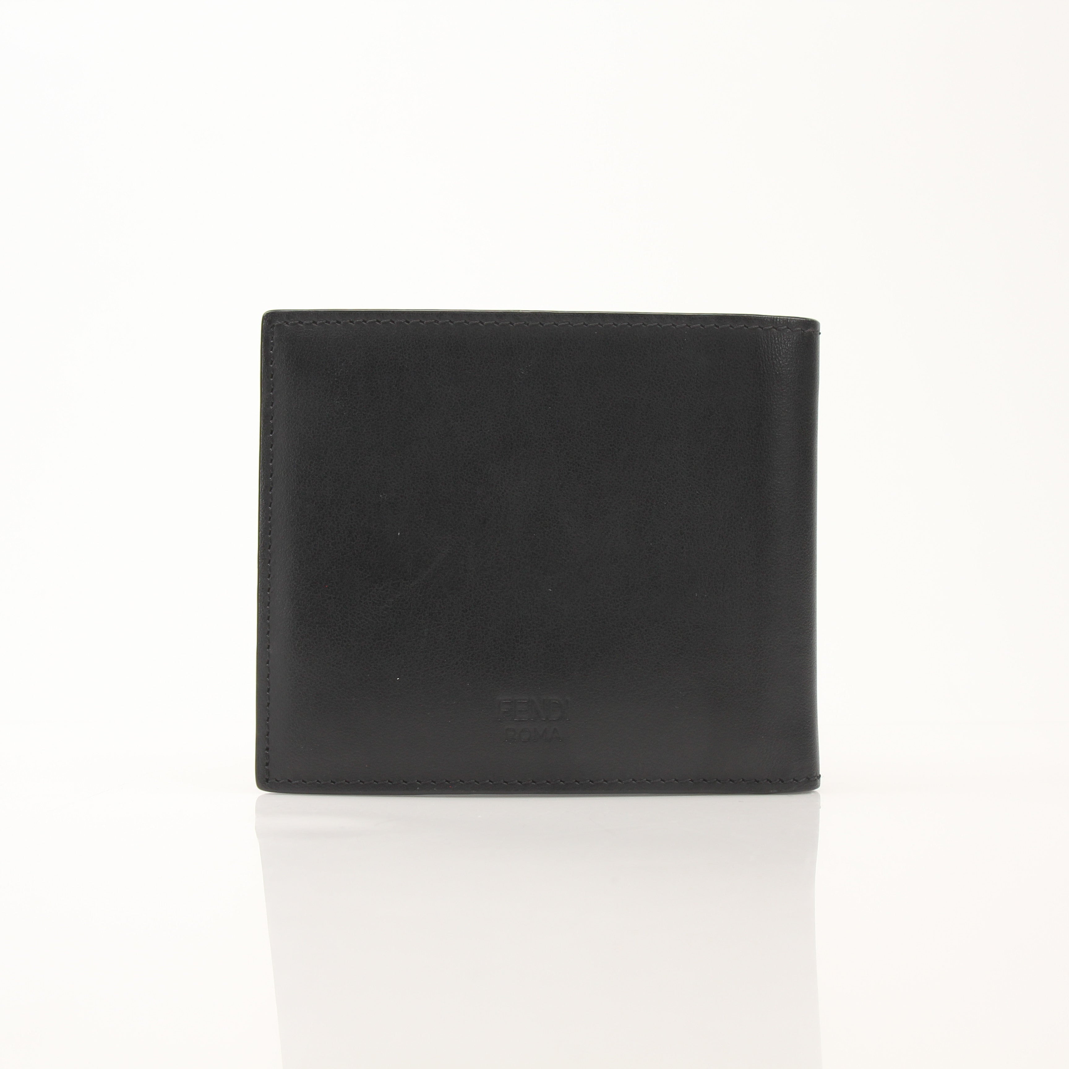 Fendi Vitello Century metal-eyed bi-fold wallet in leather with gold accents, featuring distinctive monster eye design.