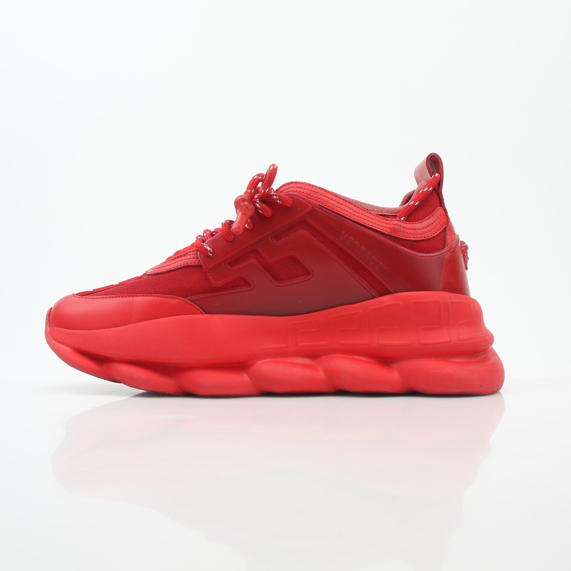 Gold & Beyond Versace Red Chain Reaction 2 Chainz sneakers featuring bold red shoes with chain details and sporty design.