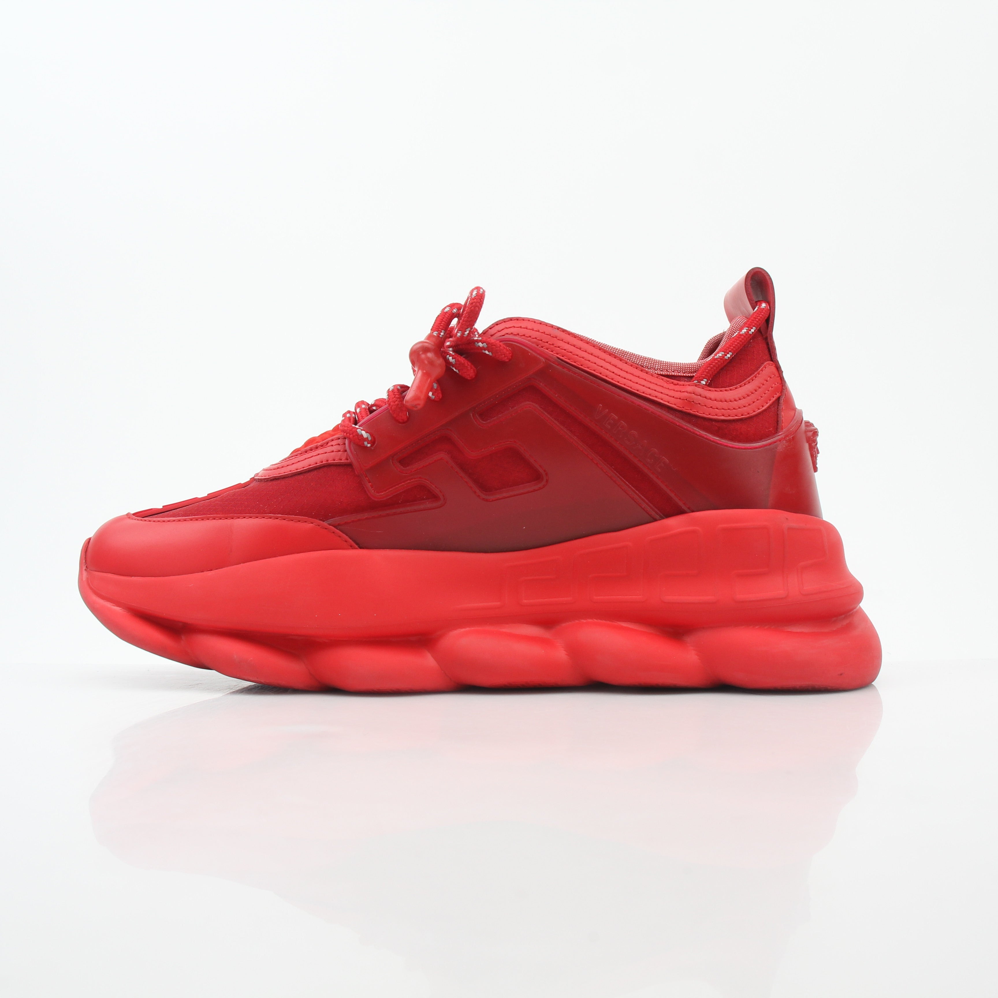 Gold & Beyond Versace Red Chain Reaction 2 Chainz sneakers featuring bold red shoes with chain details and sporty design.