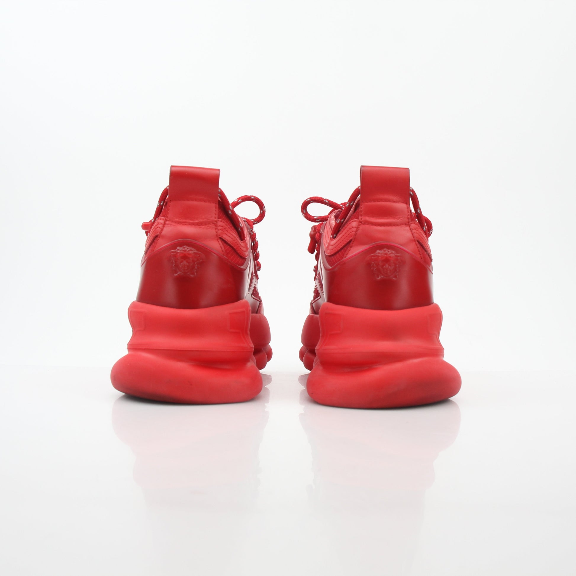 Gold & Beyond Versace Red Chain Reaction 2 Chainz sneakers featuring bold red design and intricate chain details.