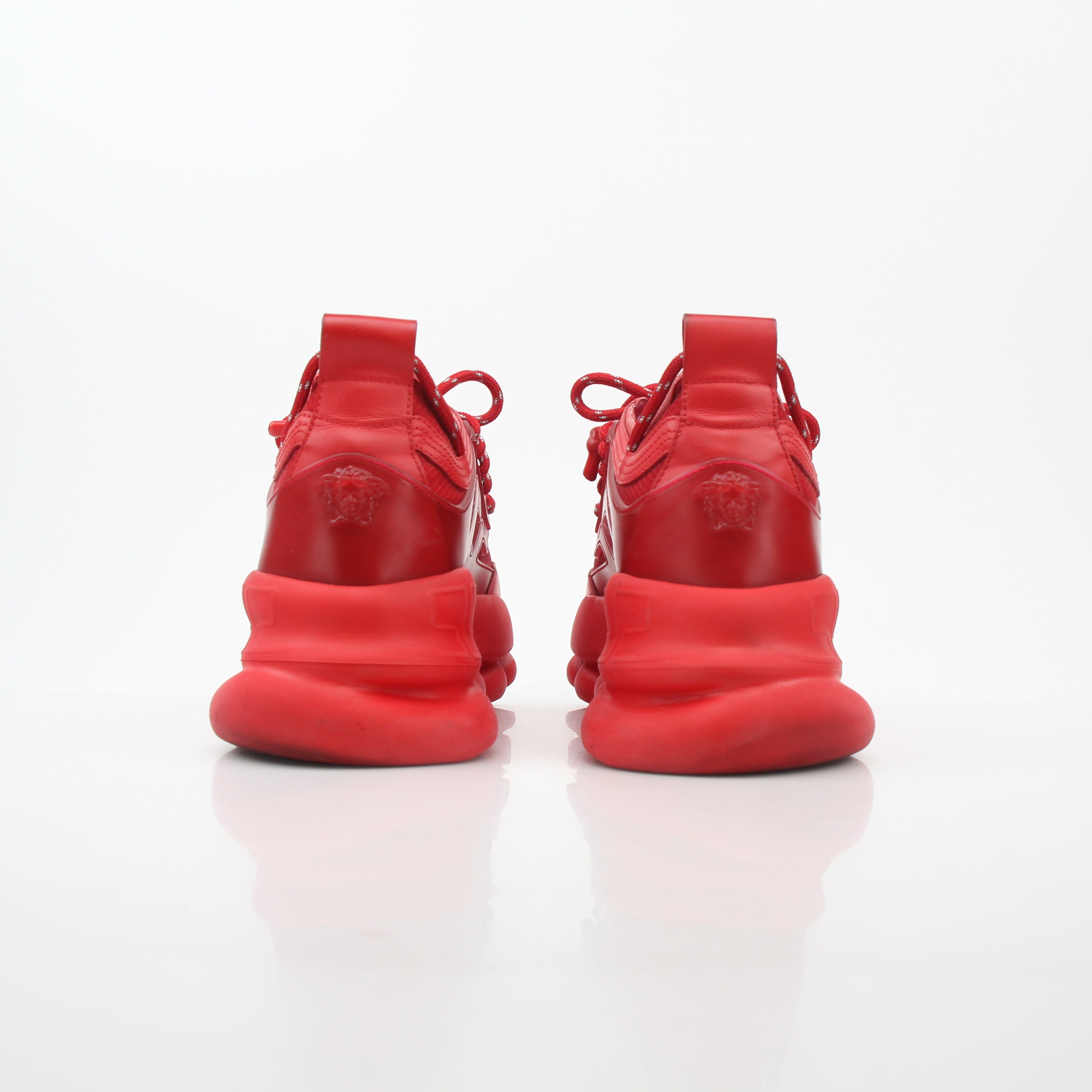 Gold & Beyond Versace Red Chain Reaction 2 Chainz sneakers featuring bold red design and intricate chain details.