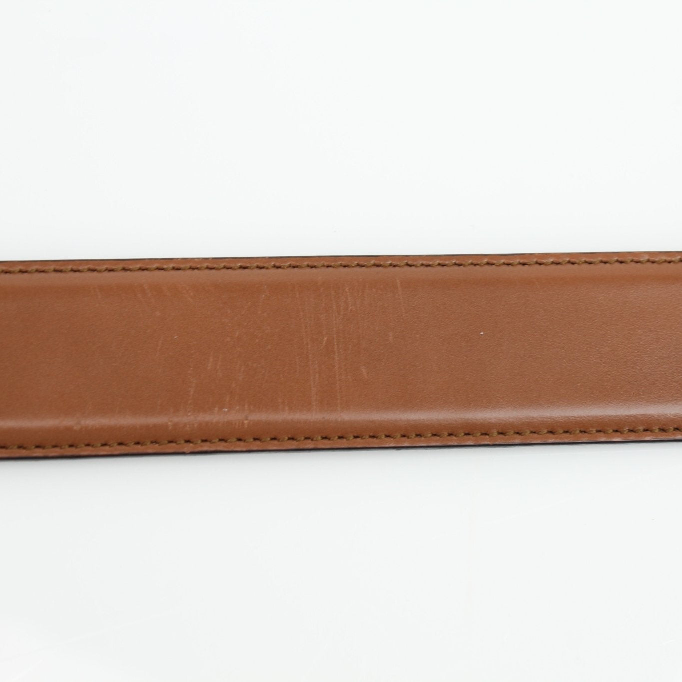 Gucci brown Dionysus belt with gold-tone hardware, leather strap, and signature GG logo detailing.