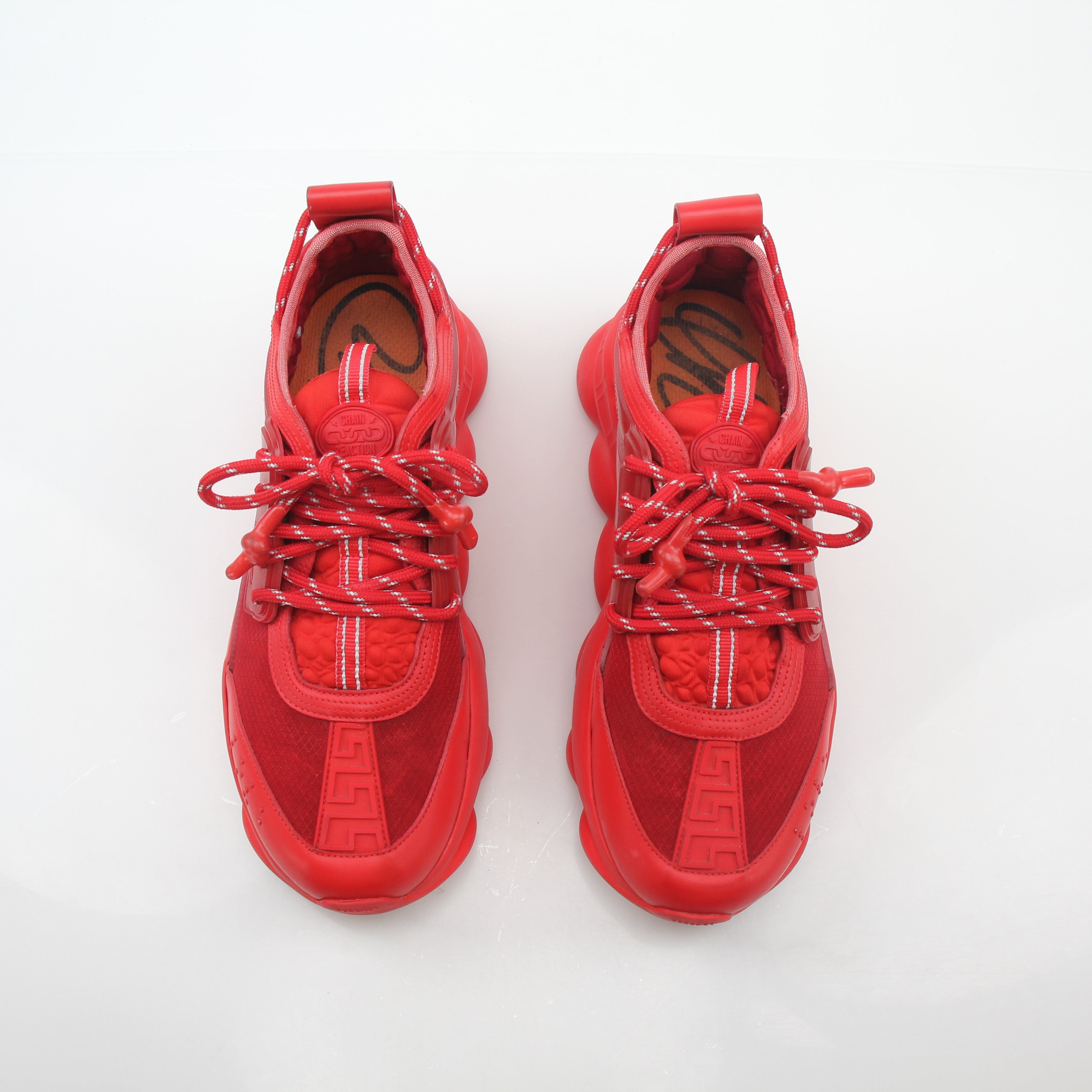 Gold & Beyond Versace Red Chain Reaction 2 Chainz sneakers showing red and white colorway with chain detail and sporty shoe design.