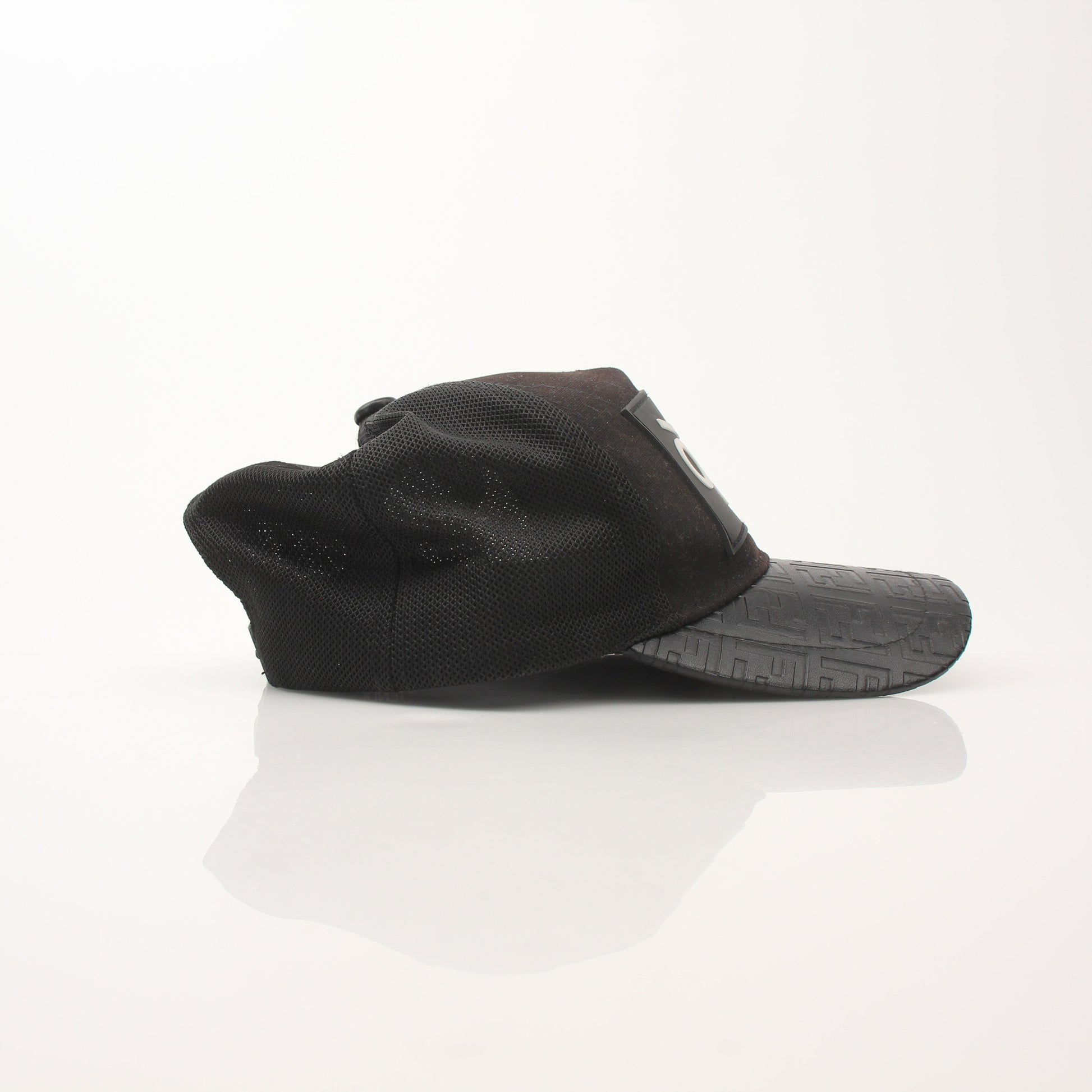 Fendi FF leather Bad Bugs robot trucker hat with adjustable strap, gold accents, and embroidered logo, styled as trendy accessories.