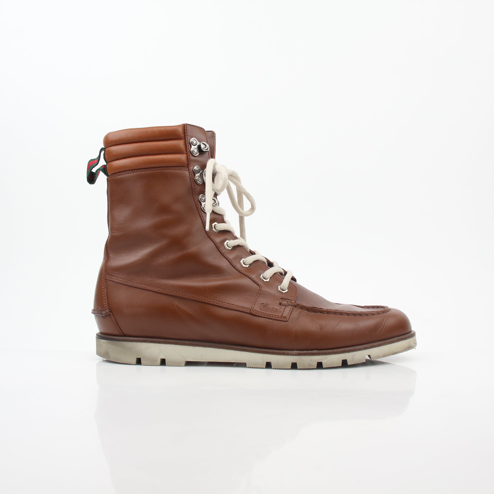 Gucci brown leather web accent hiking boots for men, showcasing rugged outsole, stylish design, and signature branding details.